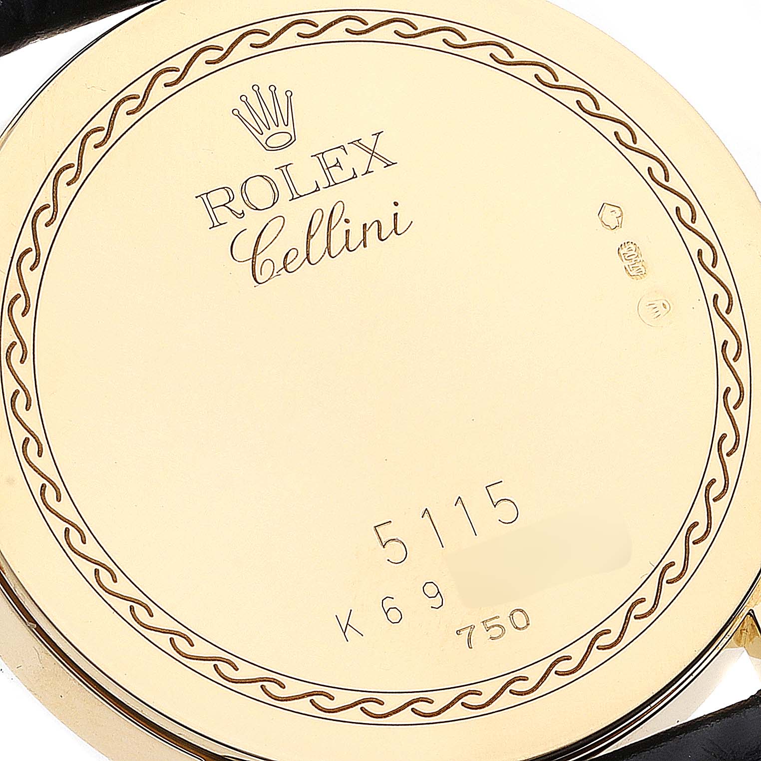 This image shows the back case of a Rolex Cellini 5115 Men's Yellow Gold Champagne Dial 5115 Men's Yellow Gold Champagne Dial model watch, highlighting the etched brand and model details.