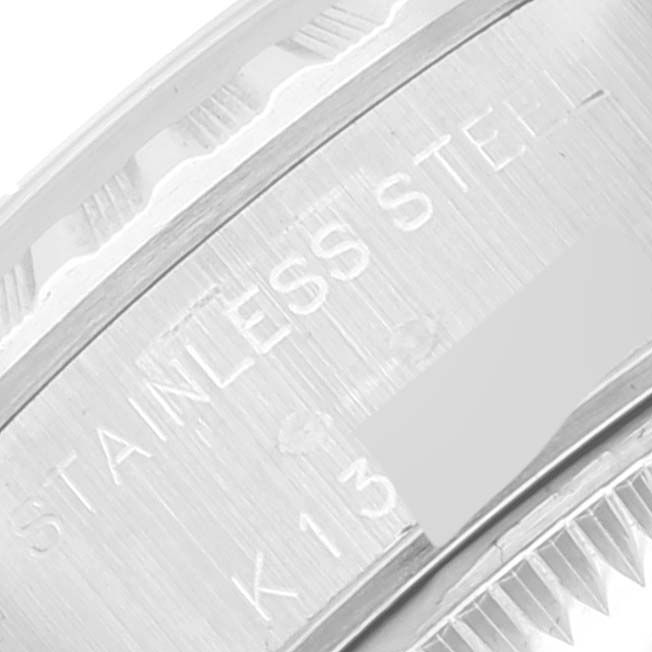 This close-up image of the Rolex Date 79240 Women
s Stainless Steel Silver Dial 79240 Women
s Stainless Steel Silver Dial watch shows part of the outer case, including the stainless steel engraving.