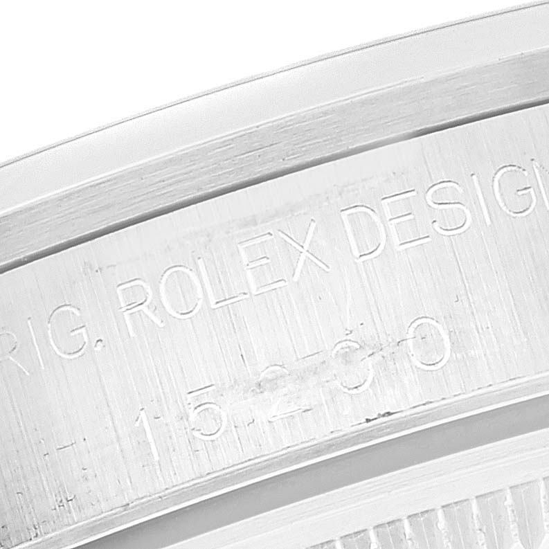 This image shows a close-up angle of the engraved text on the side of the case of a Rolex Date 15200 Men's Stainless Steel Silver Dial 15200 Men's Stainless Steel Silver Dial watch.