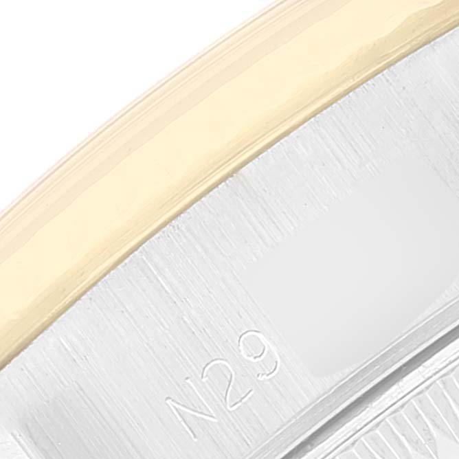 This close-up image of a Rolex Datejust 69173 Women's Steel and Gold (two tone) Champagne Dial 69173 Women's Steel and Gold (two tone) Champagne Dial watch shows part of the bezel and engraved numerals.