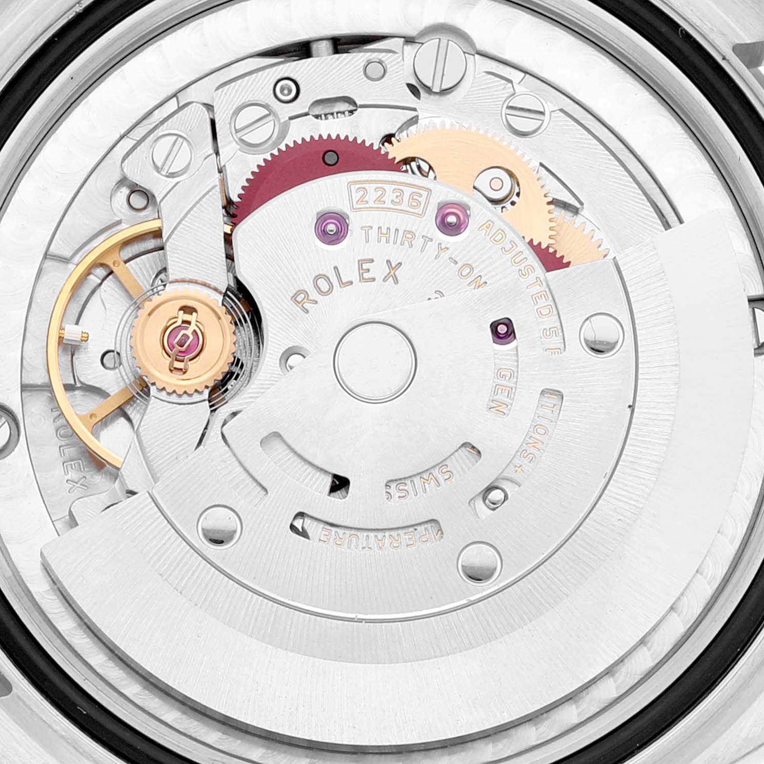 This image shows a close-up of the movement mechanism of the Rolex Mid-Size 278384 Women's Stainless Steel Mother of Pearl Dial 278384 Women's Stainless Steel Mother of Pearl Dial model 2236 watch, showcasing gears and components.