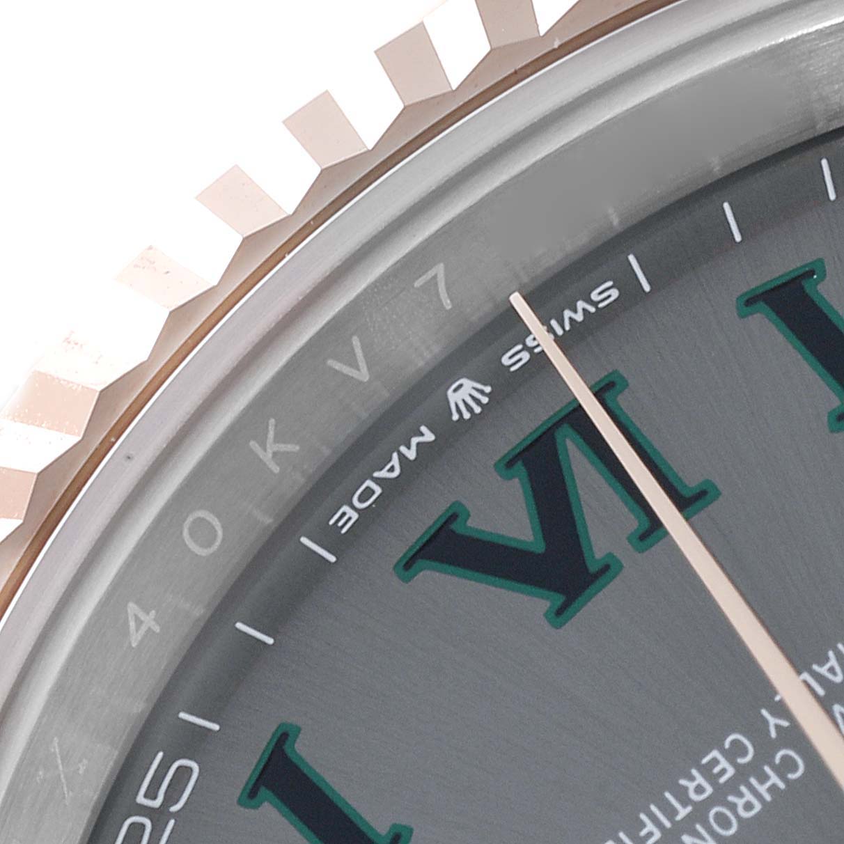 This image shows a close-up of the dial and fluted bezel of the Rolex Datejust 41 126331 Men's Steel and Gold (two tone) Grey Dial 126331 Men's Steel and Gold (two tone) Grey Dial watch, highlighting the "SWISS MADE" text.