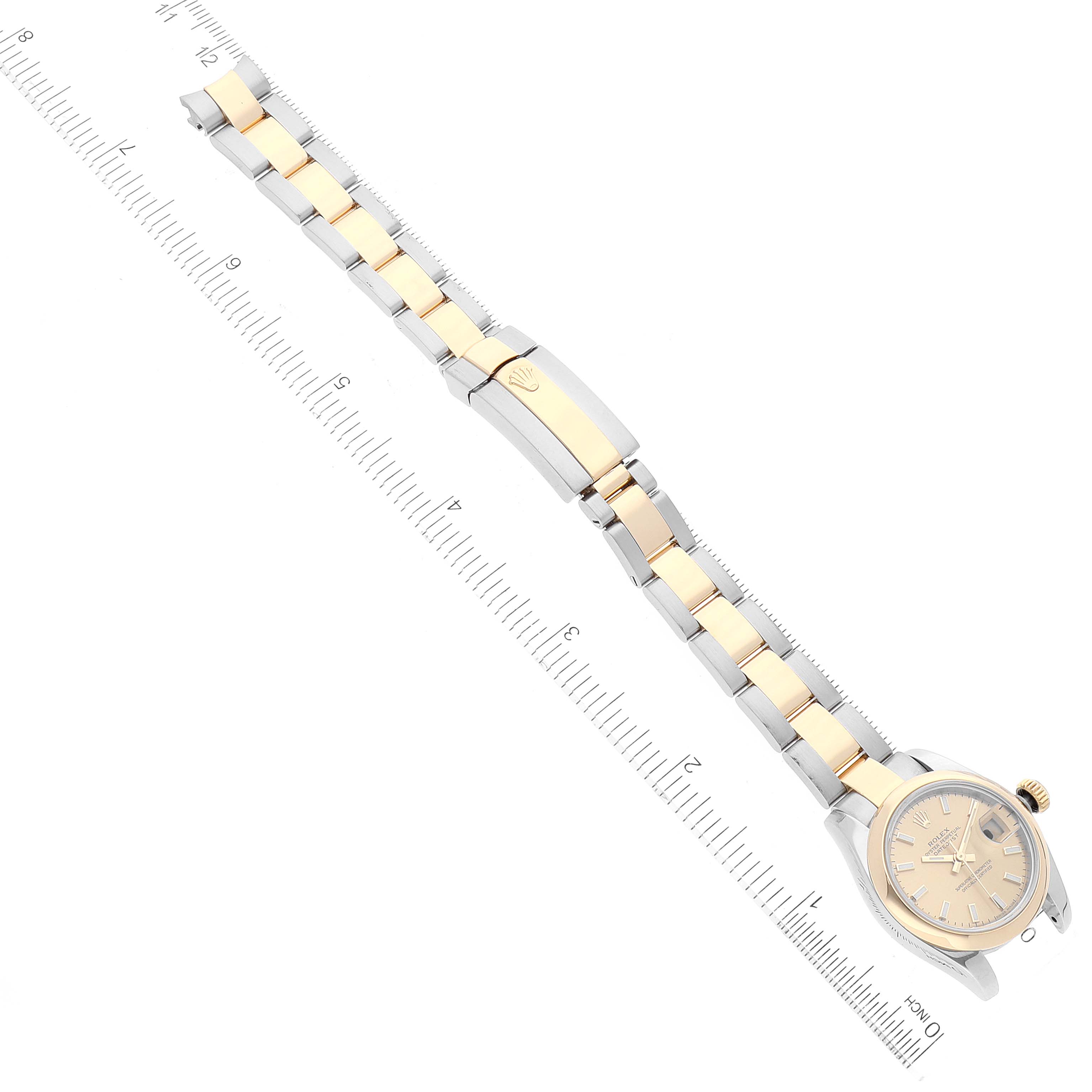 The image shows a Rolex Datejust 179163 Women's Steel and Gold (two tone) Champagne Dial 179163 Women's Steel and Gold (two tone) Champagne Dial watch laid flat with its two-tone bracelet fully extended and aligned with a ruler.