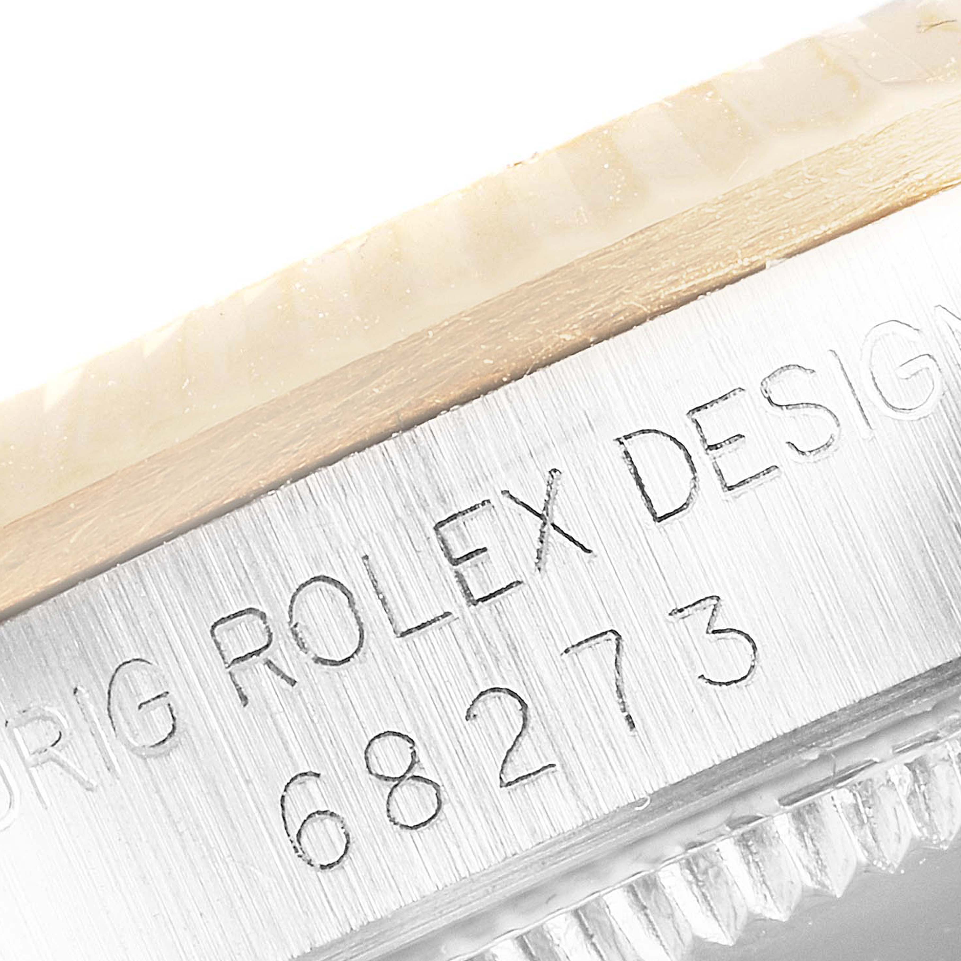 This image shows a close-up of the case side and edge of the bezel of a Rolex Mid-Size 68273 Women's Steel and Gold (two tone) Champagne Dial 68273 Women's Steel and Gold (two tone) Champagne Dial model 68273.