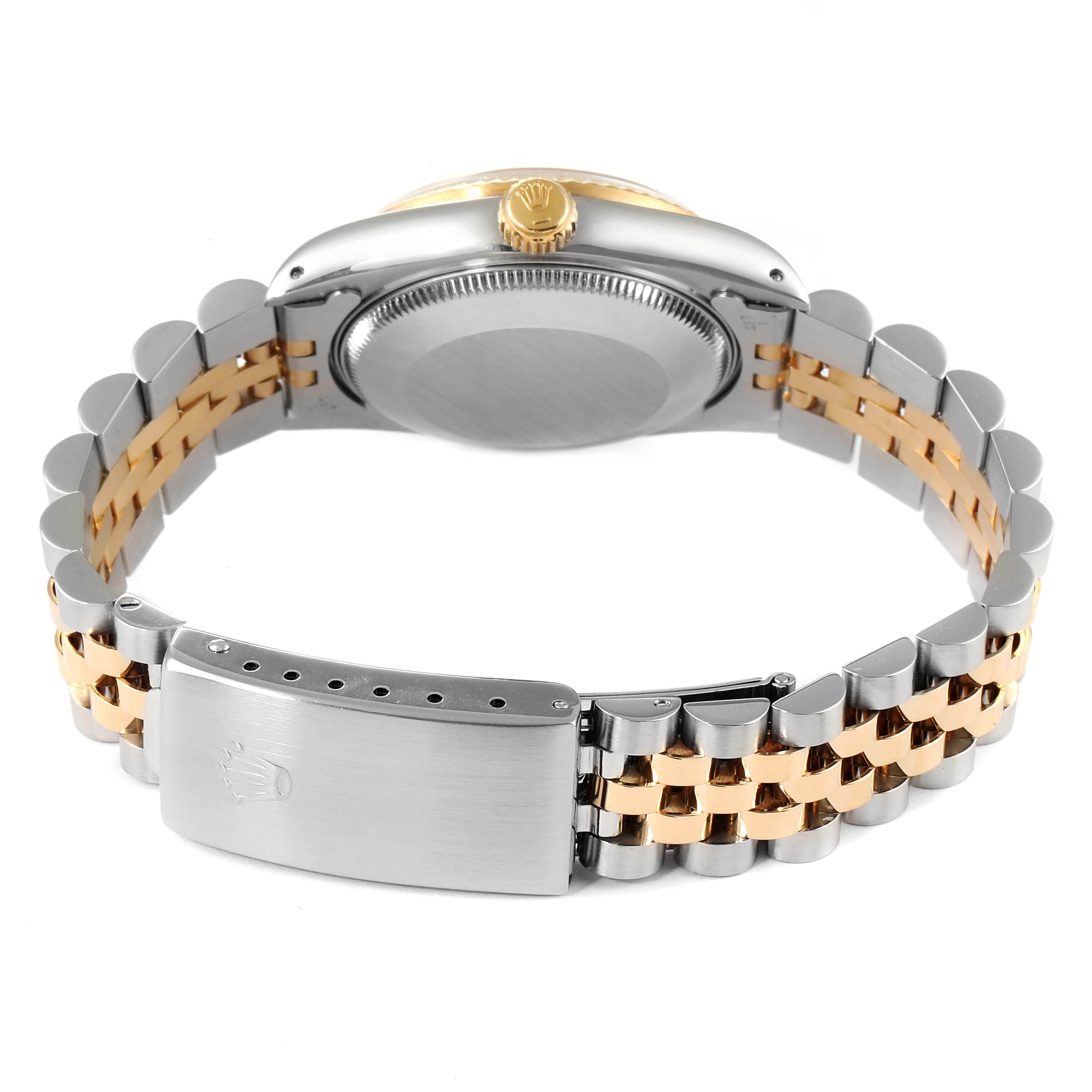 This image shows the back and bracelet of a Rolex Mid-Size 68273 Women's Steel and Gold (two tone) Champagne Dial 68273 Women's Steel and Gold (two tone) Champagne Dial watch, highlighting its clasp, two-tone links, and case back.