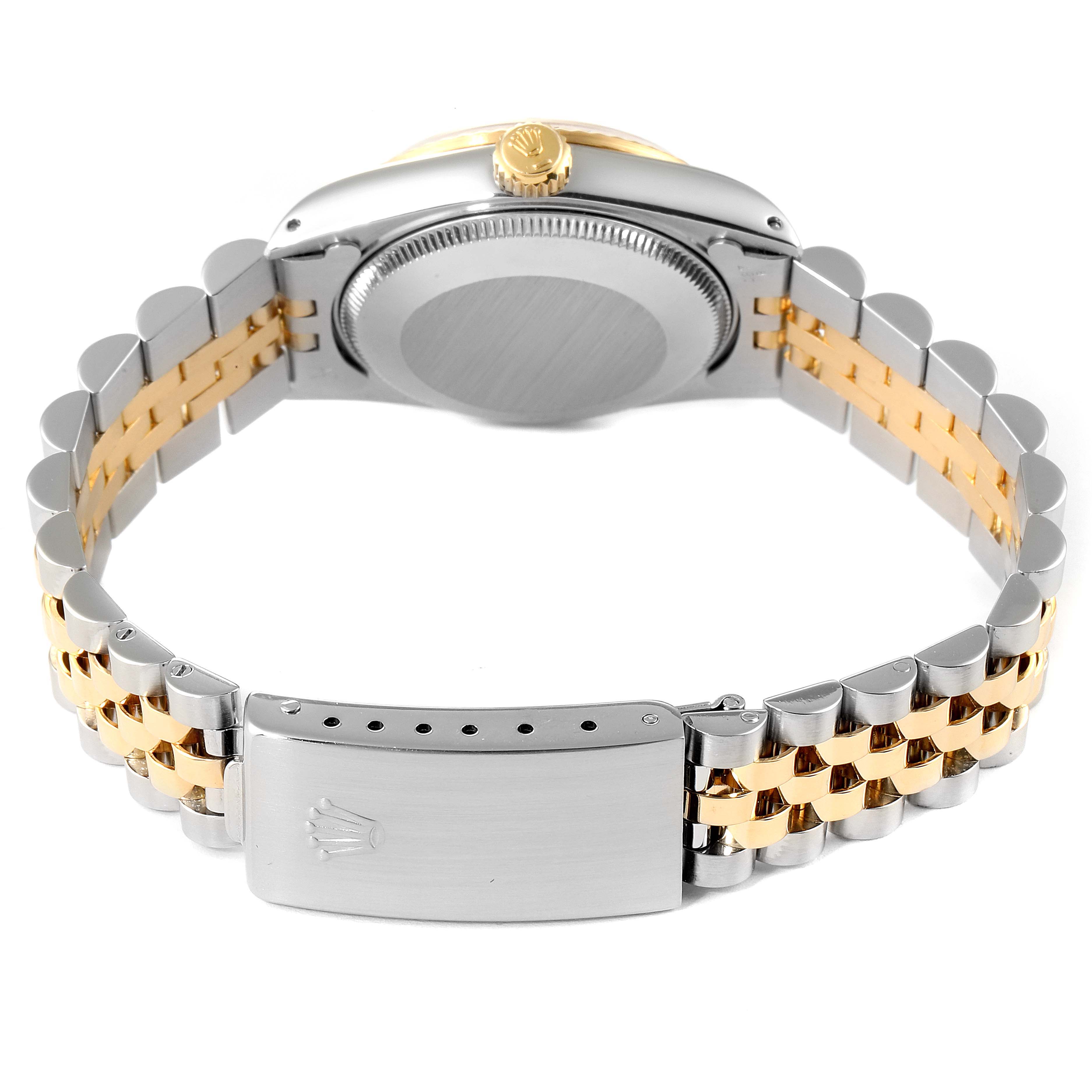 The image shows the back and bracelet of a Rolex Mid-Size 68273 Women
s Steel and Gold (two tone) Champagne Dial 68273 Women
s Steel and Gold (two tone) Champagne Dial watch featuring a two-tone metal design and a clasp with the Rolex logo.