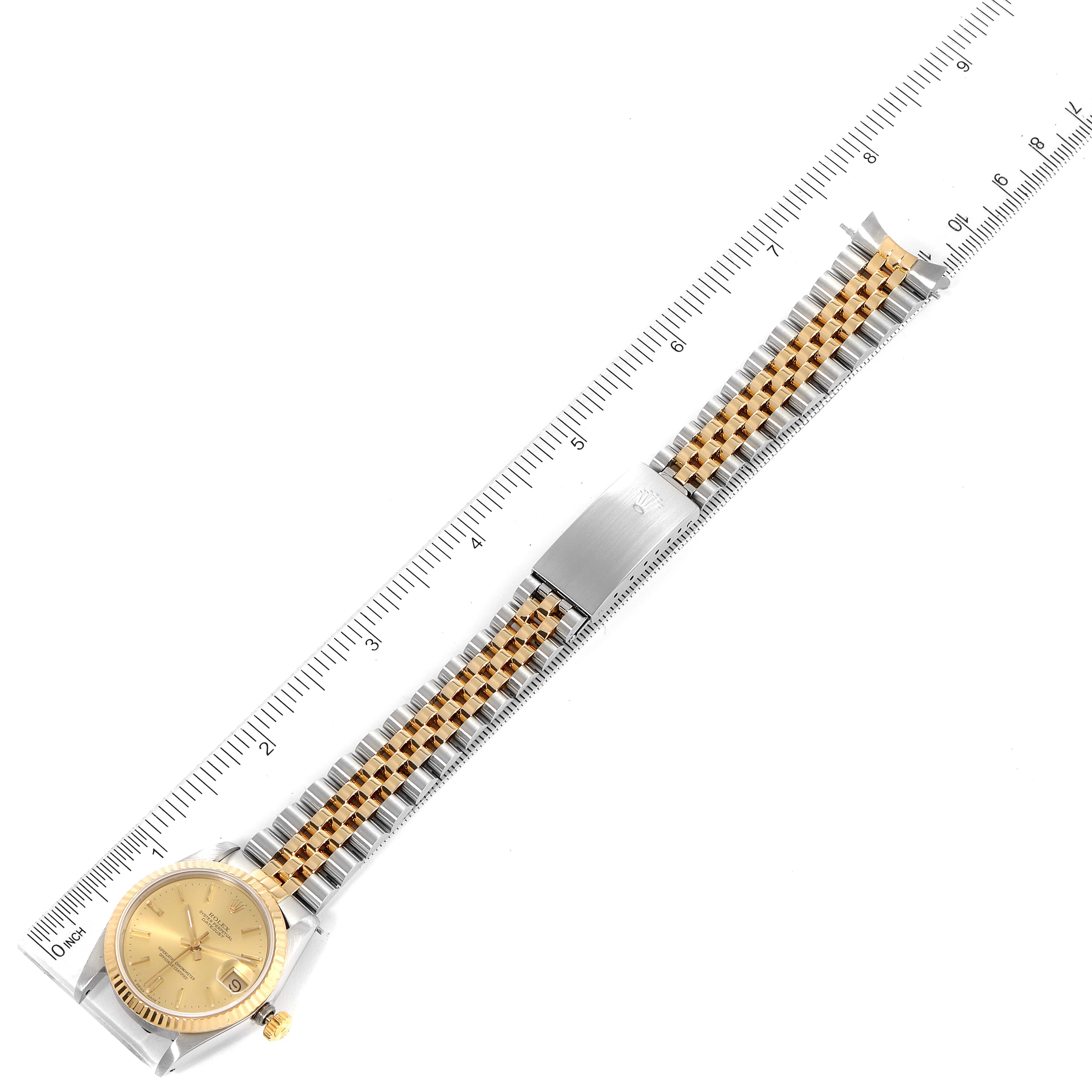 The image shows a top-down view of a Rolex Mid-Size 68273 Women
s Steel and Gold (two tone) Champagne Dial 68273 Women
s Steel and Gold (two tone) Champagne Dial watch, highlighting the face, bezel, and two-tone bracelet.