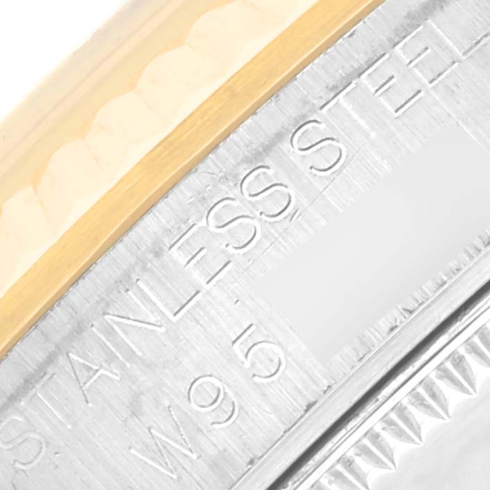 The image shows a close-up of the bezel and case edge on a Mid-Size Rolex watch.