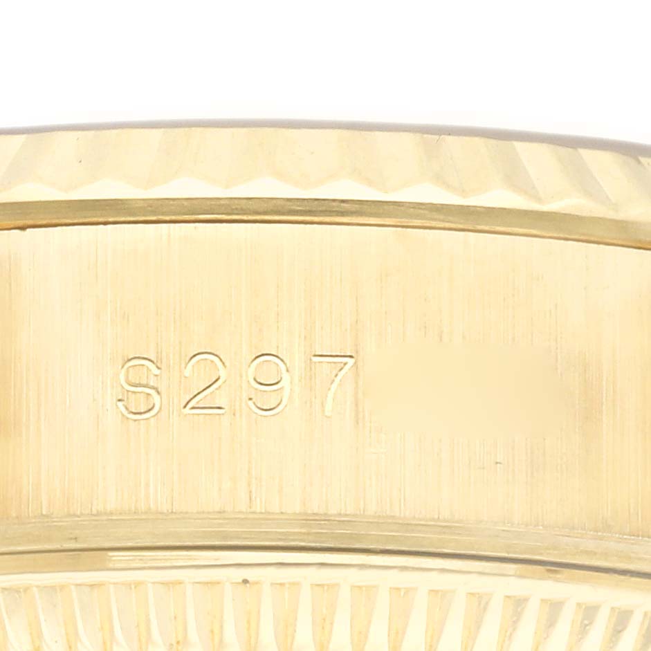 The image shows a close-up of the stamped serial number on the side of the case of a Rolex President 69178 Women's Yellow Gold Champagne Dial 69178 Women's Yellow Gold Champagne Dial model.