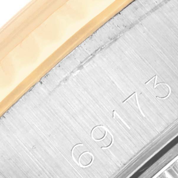 This image shows a close-up view of the case and part of the serial number "69173" on the Rolex Datejust 69173 Women's Steel and Gold (two tone) Beige Dial 69173 Women's Steel and Gold (two tone) Beige Dial watch.