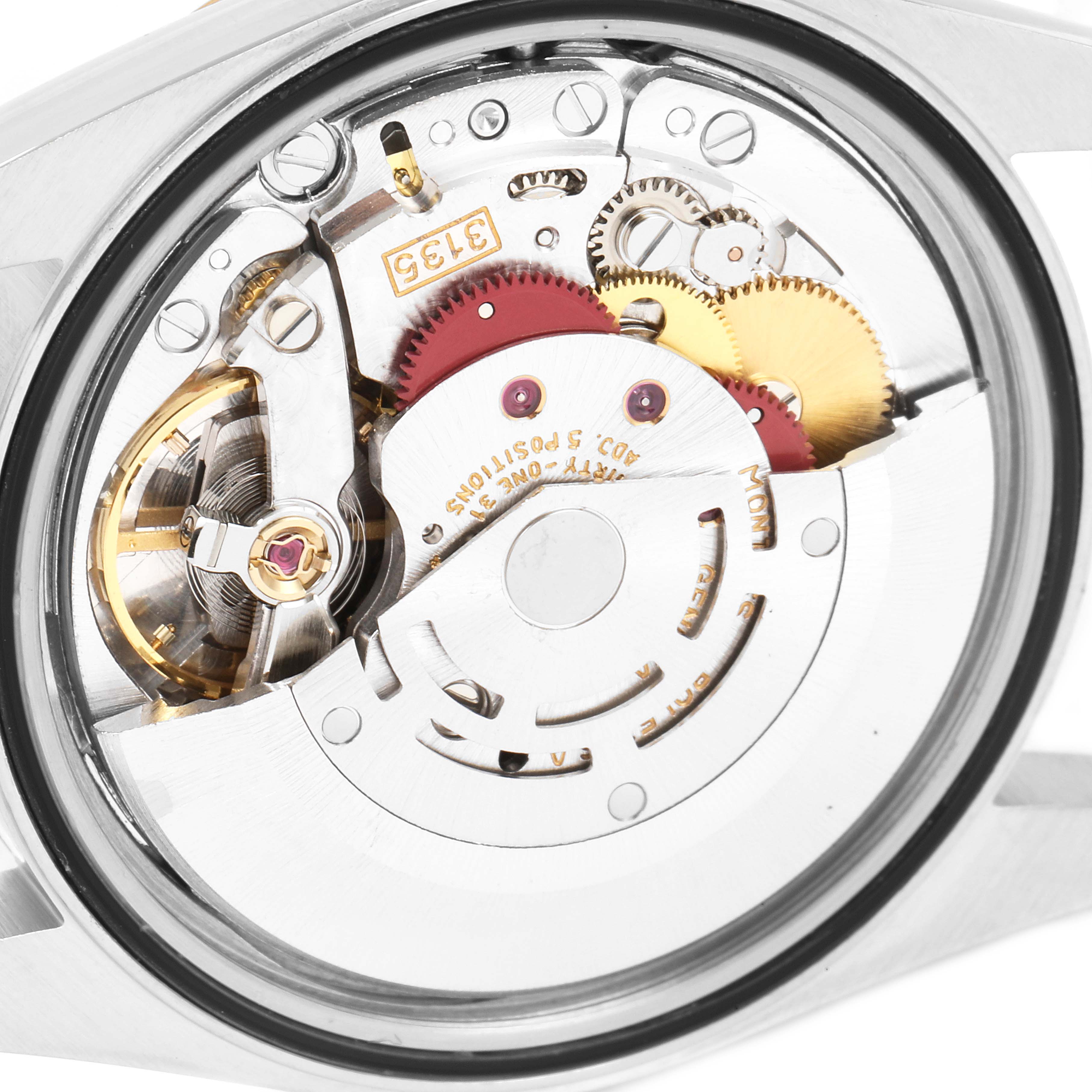 The image shows the internal mechanism of a Rolex Datejust 16233 Men's Steel and Gold (two tone) Champagne Dial 16233 Men's Steel and Gold (two tone) Champagne Dial watch from a rear angle, highlighting its gears and movement components.