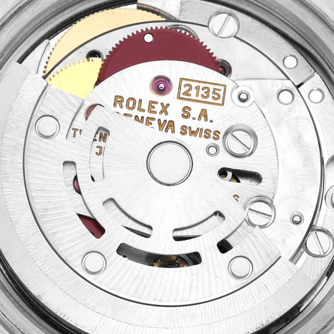 The image shows an internal view of the movement mechanism of a Rolex Datejust 69174 Women's Stainless Steel Silver Dial 69174 Women's Stainless Steel Silver Dial watch, focusing on gears and the rotor.