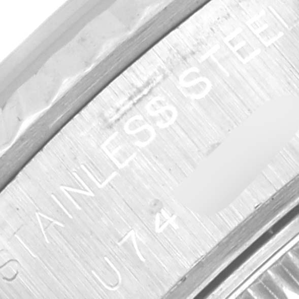 This image shows a close-up of the stainless steel part and engraved text of the Rolex Datejust 69174 Women's Stainless Steel Silver Dial 69174 Women's Stainless Steel Silver Dial watch.