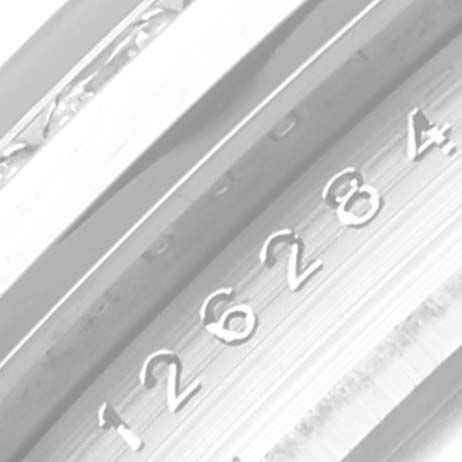 This image shows a close-up of the serial number engraving on the side of the bezel of a Rolex Datejust 126284 Men's Stainless Steel Mother of Pearl Dial 126284 Men's Stainless Steel Mother of Pearl Dial watch.