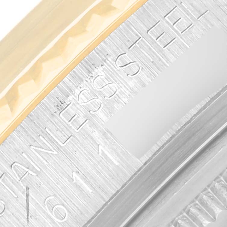 Close-up of the bezel and case edge of a Rolex Vintage Collection 16013 Men's Steel and Gold (two tone) Champagne Dial 16013 Men's Steel and Gold (two tone) Champagne Dial model, showing "STAINLESS STEEL" engraving.