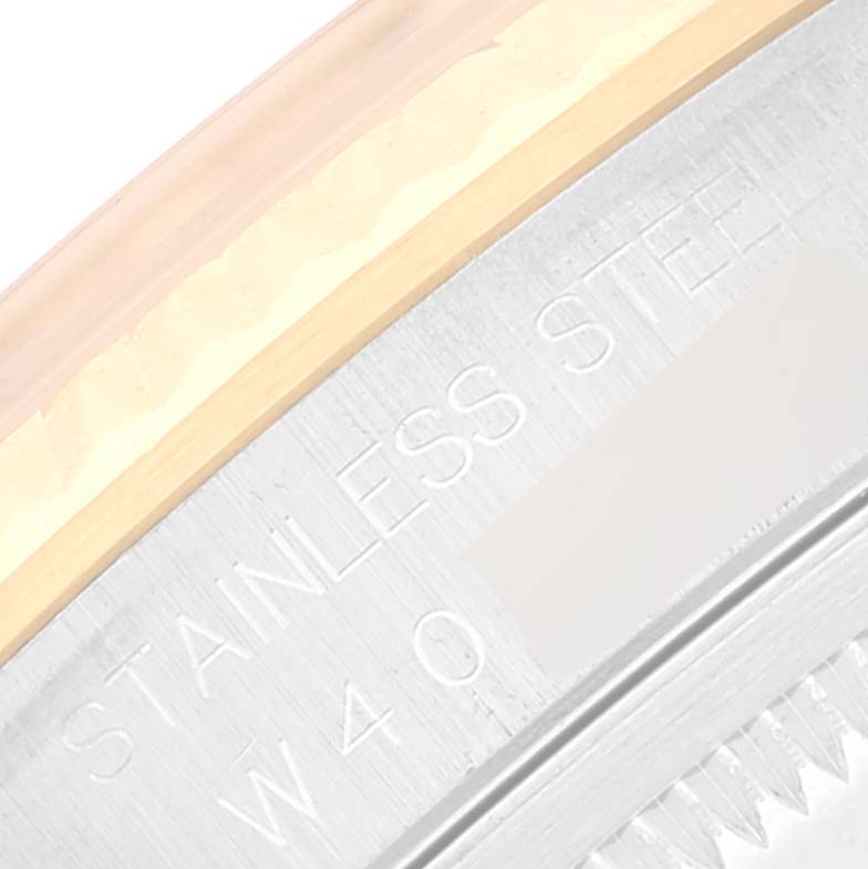 The image shows a close-up of the side engraving on a Rolex Datejust 16233 Men's Steel and Gold (two tone) Champagne Dial 16233 Men's Steel and Gold (two tone) Champagne Dial model's case back, highlighting the text "STAINLESS STEEL."