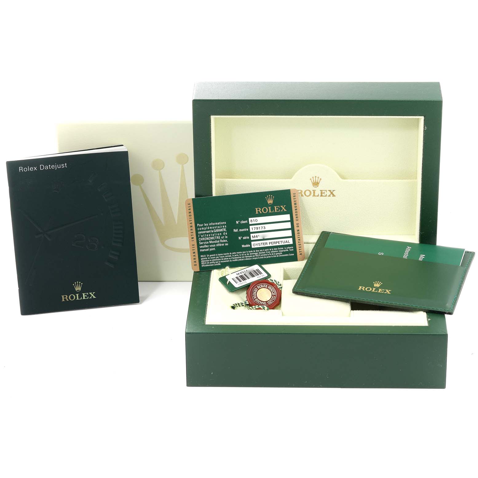 This image shows the packaging and accessories for a Rolex Datejust 179173 Women
s Steel and Gold (two tone) White Dial 179173 Women
s Steel and Gold (two tone) White Dial, including the box, booklet, warranty card, and tags.