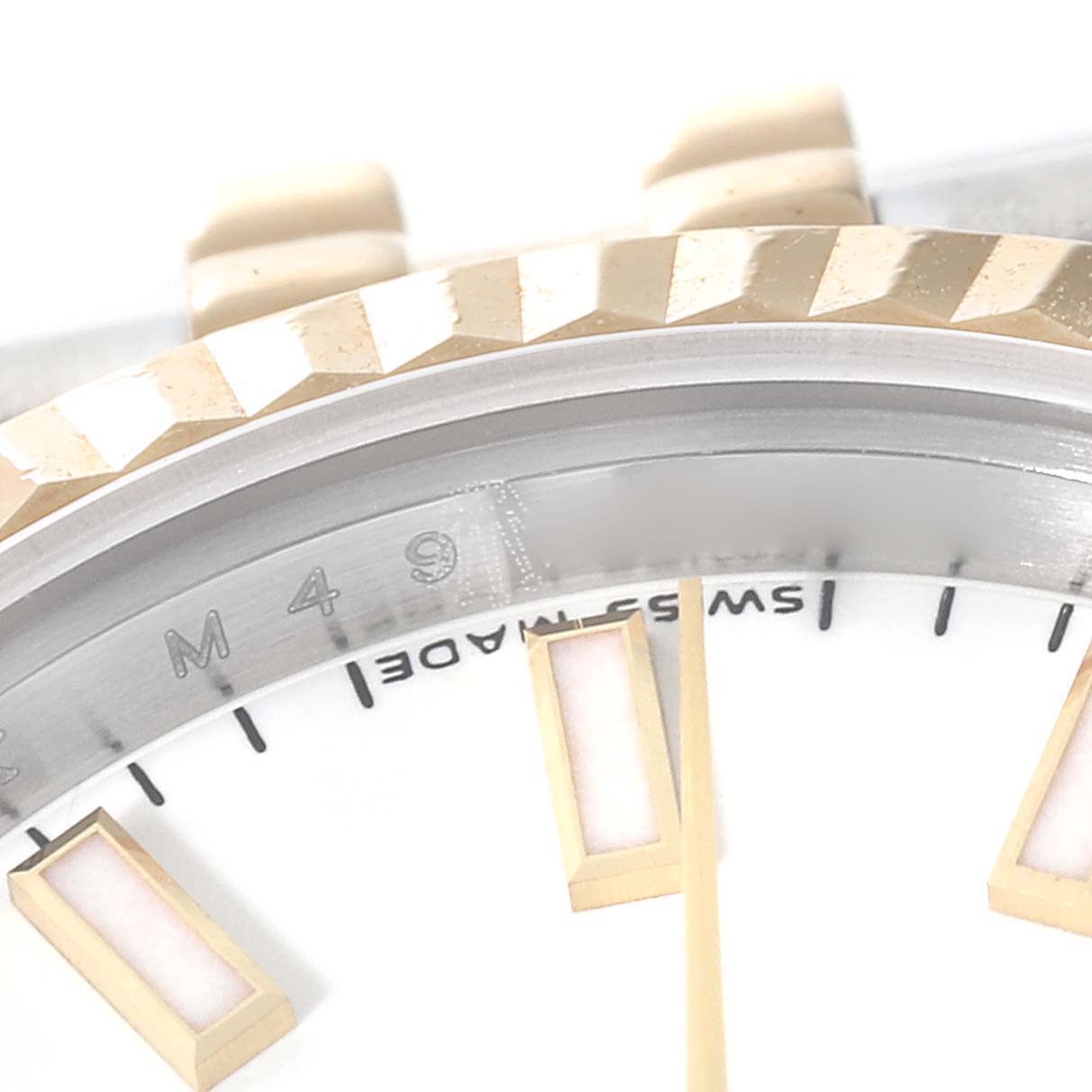 The image shows a close-up of the dial, bezel, and part of the hour markers of a Rolex Datejust 179173 Women
s Steel and Gold (two tone) White Dial 179173 Women
s Steel and Gold (two tone) White Dial watch.