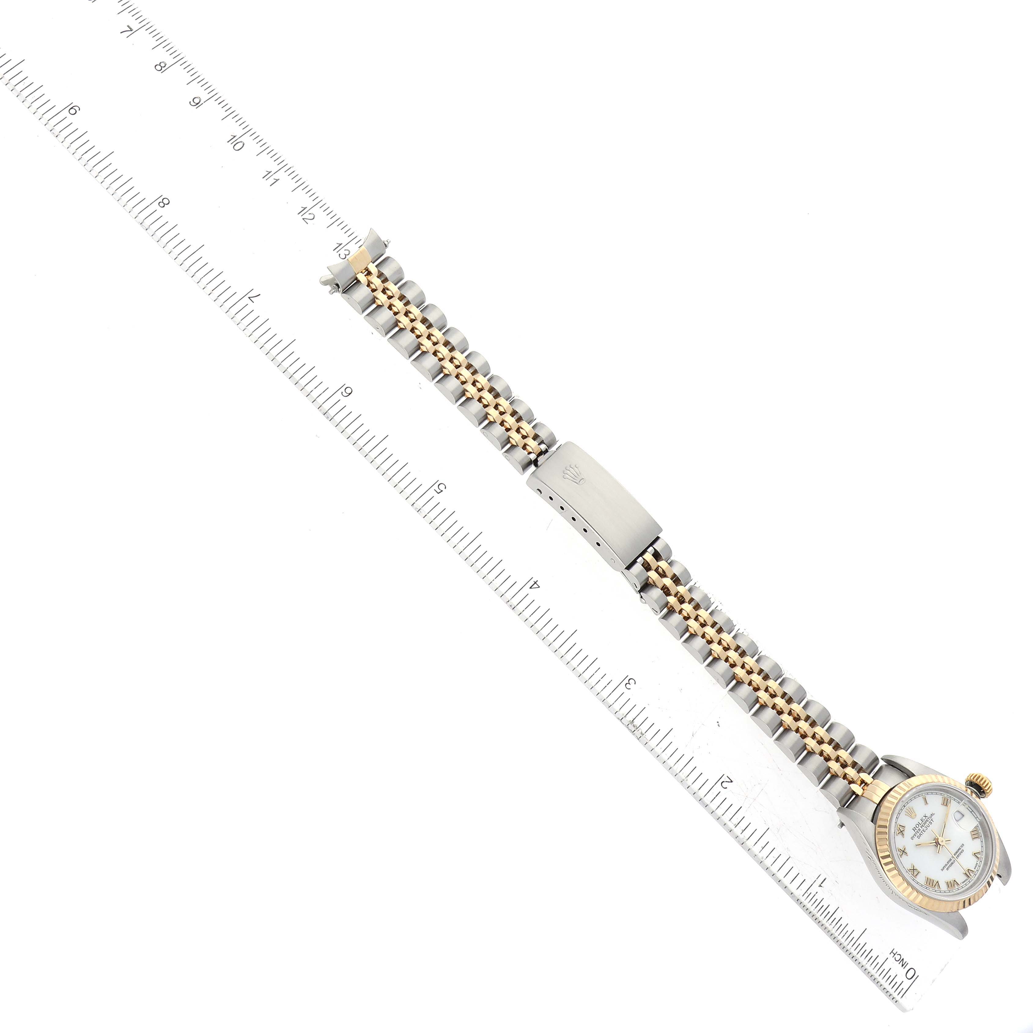 The image shows a top-down view of a Rolex Datejust 69173 Women's Steel and Gold (two tone) White Dial 69173 Women's Steel and Gold (two tone) White Dial watch with its full bracelet and part of the watchface.