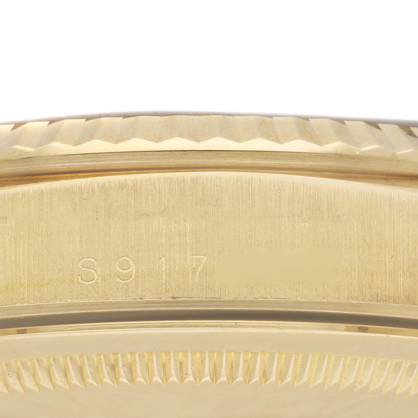 This image shows a close-up of the side of the Rolex President 18238 Men
s Yellow Gold Champagne Dial 18238 Men
s Yellow Gold Champagne Dial model, focusing on the case and serial number.