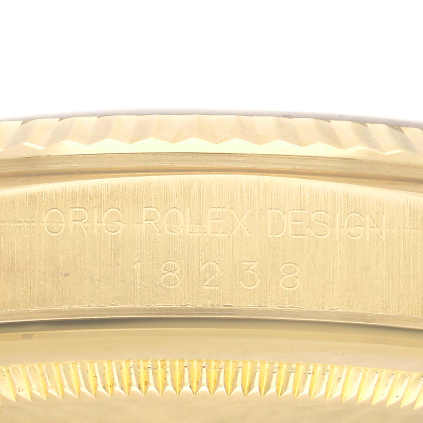 This close-up image shows the engraved side of the Rolex President 18238 Men
s Yellow Gold Champagne Dial 18238 Men
s Yellow Gold Champagne Dial model watch with the design number 18238.