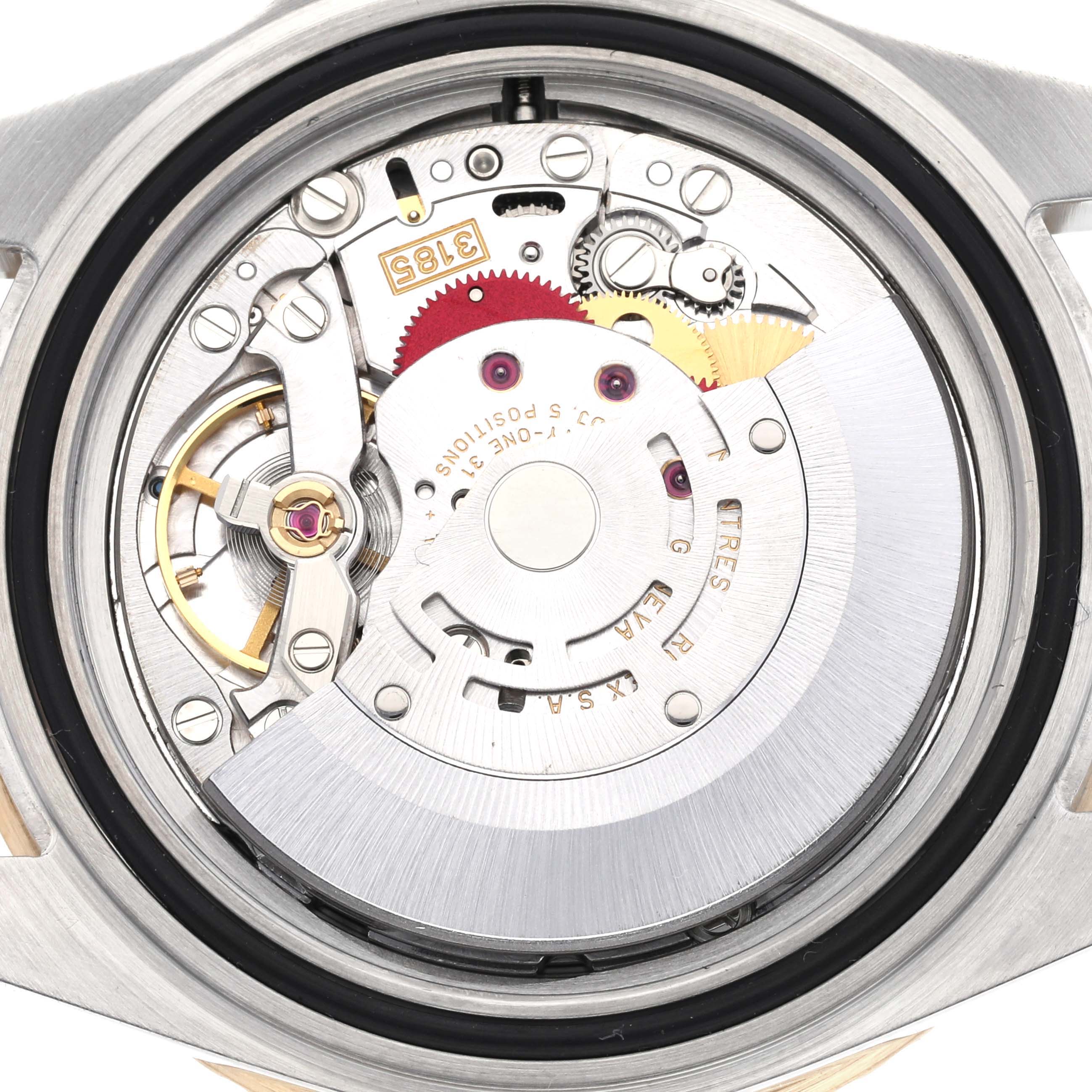 The image shows a close-up view of the Rolex GMT-Master 16713 Men's Steel and Gold (two tone) Black Dial 16713 Men's Steel and Gold (two tone) Black Dial's movement and internal mechanism components.