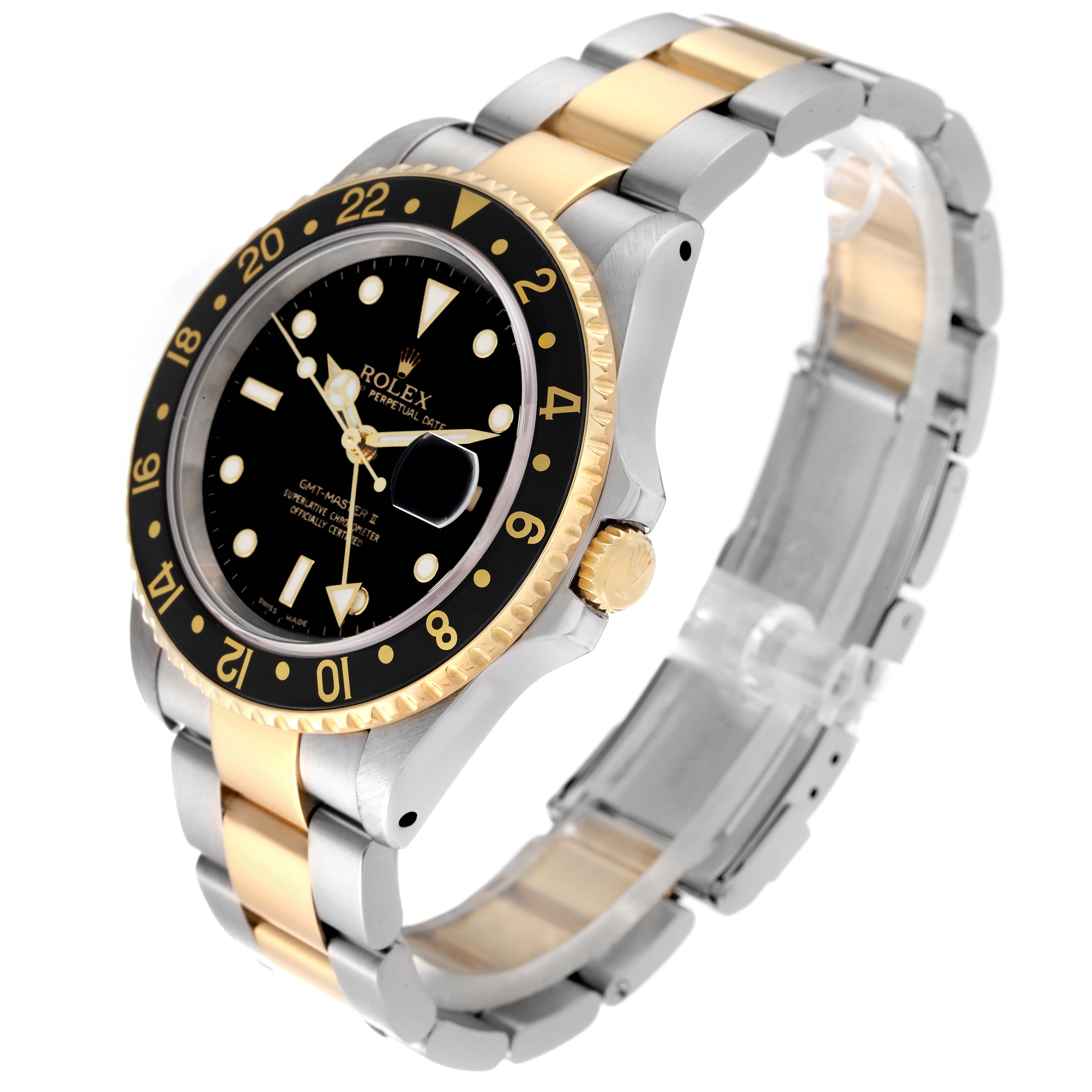 The image shows a Rolex GMT-Master 16713 Men's Steel and Gold (two tone) Black Dial 16713 Men's Steel and Gold (two tone) Black Dial II watch at an oblique angle, displaying its bezel, dial, and two-tone bracelet.