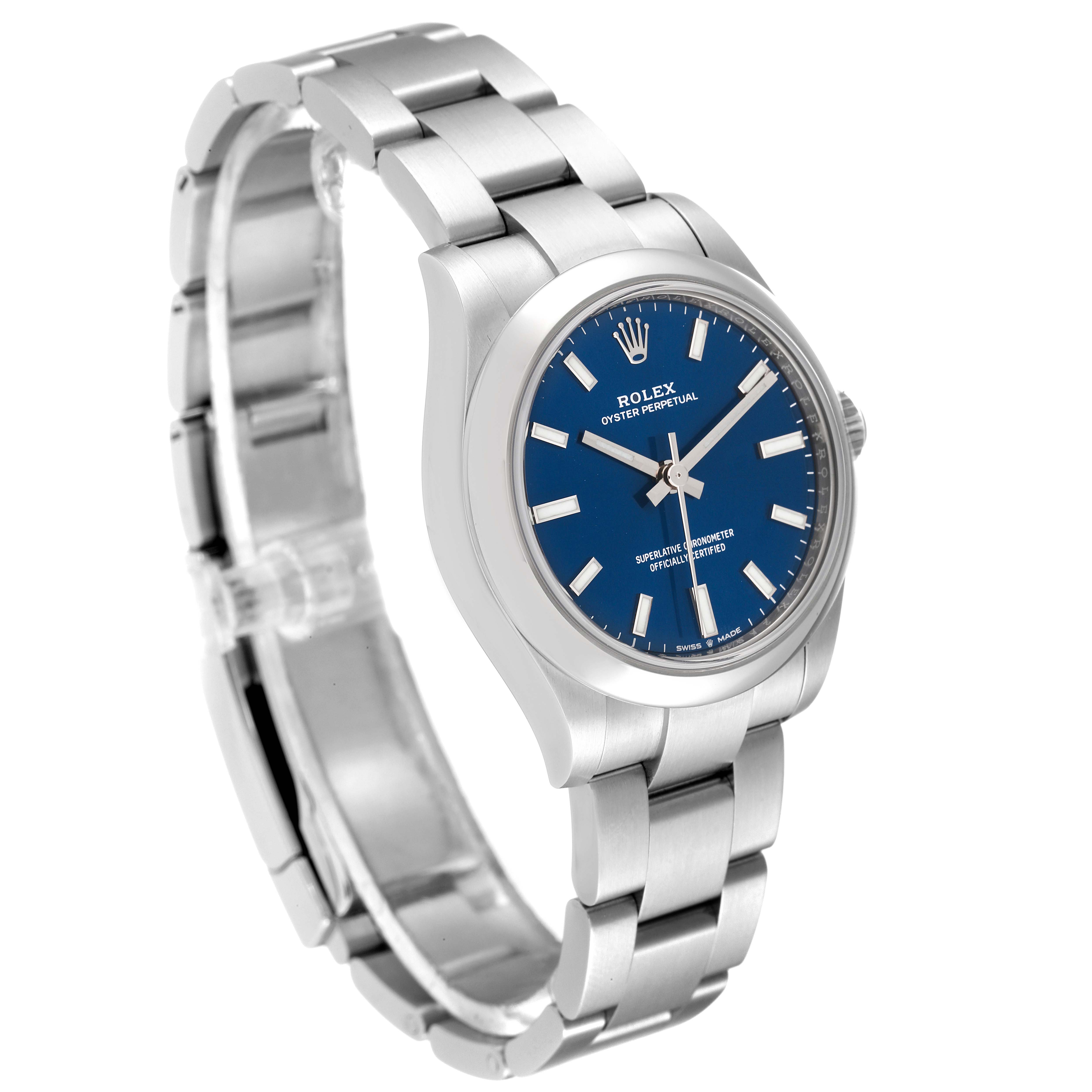 The image shows a mid-size Rolex Oyster Perpetual watch angled to display the blue dial, stainless steel case, and bracelet.