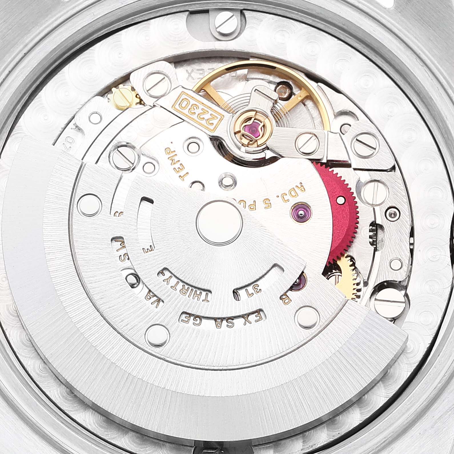 This image shows the internal movement mechanism of a Mid-Size Rolex watch from a close-up angle.