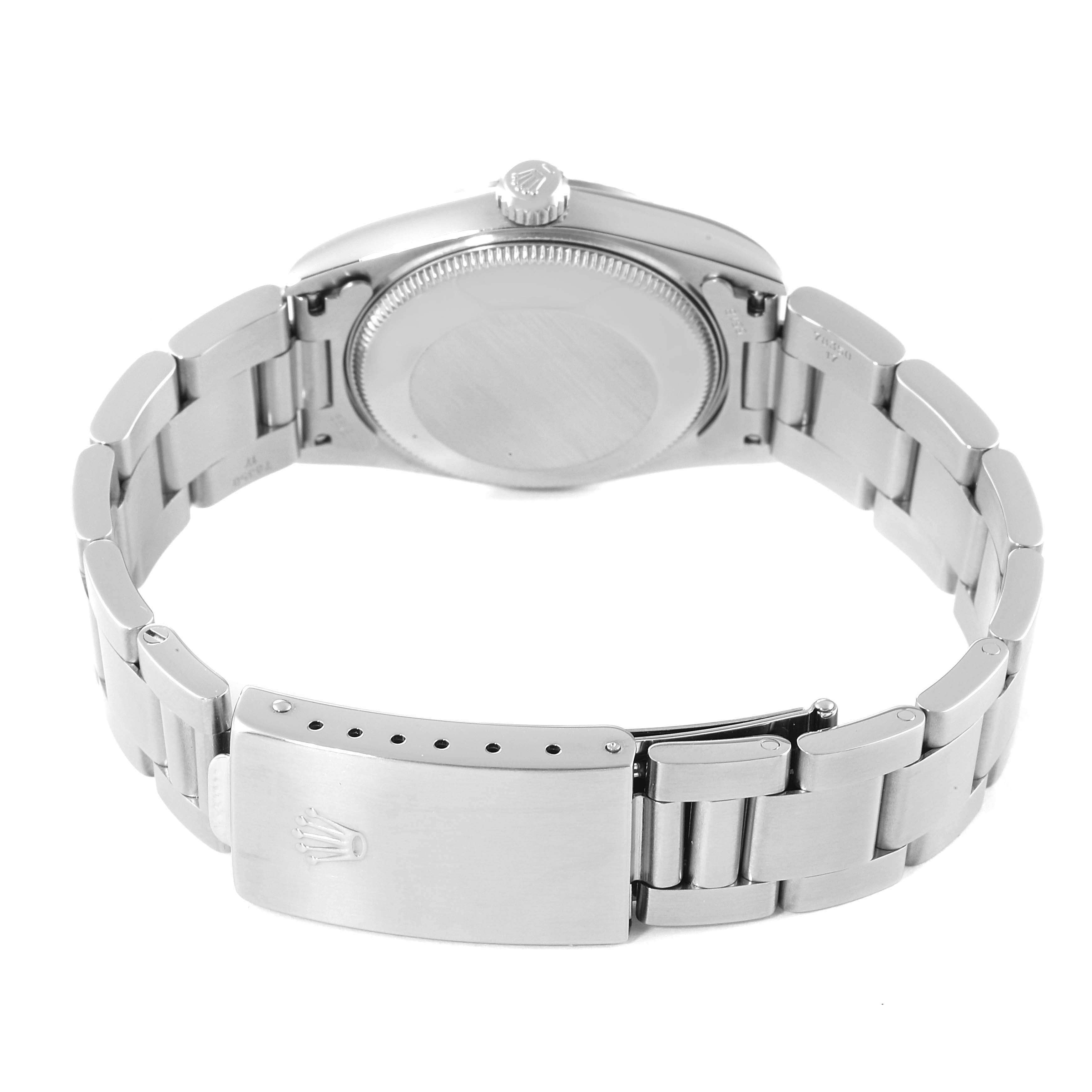 This image shows the back view of a Mid-Size Rolex watch, including the case back, crown, and metal bracelet with clasp.