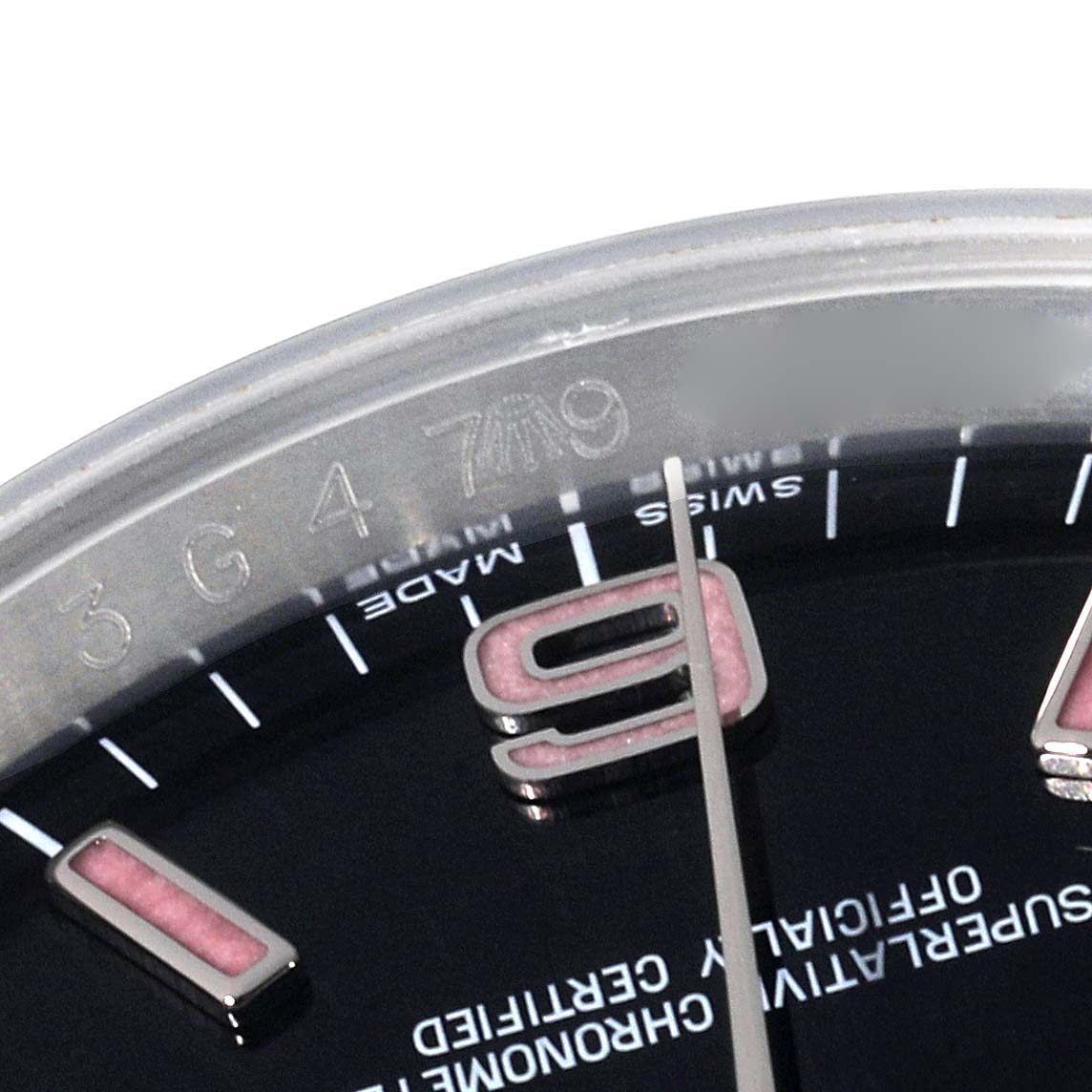 This close-up image shows a partial view of the dial, bezel, and some of the markings on a Rolex Oyster Perpetual 116000 Men's Stainless Steel Black Dial 116000 Men's Stainless Steel Black Dial watch.