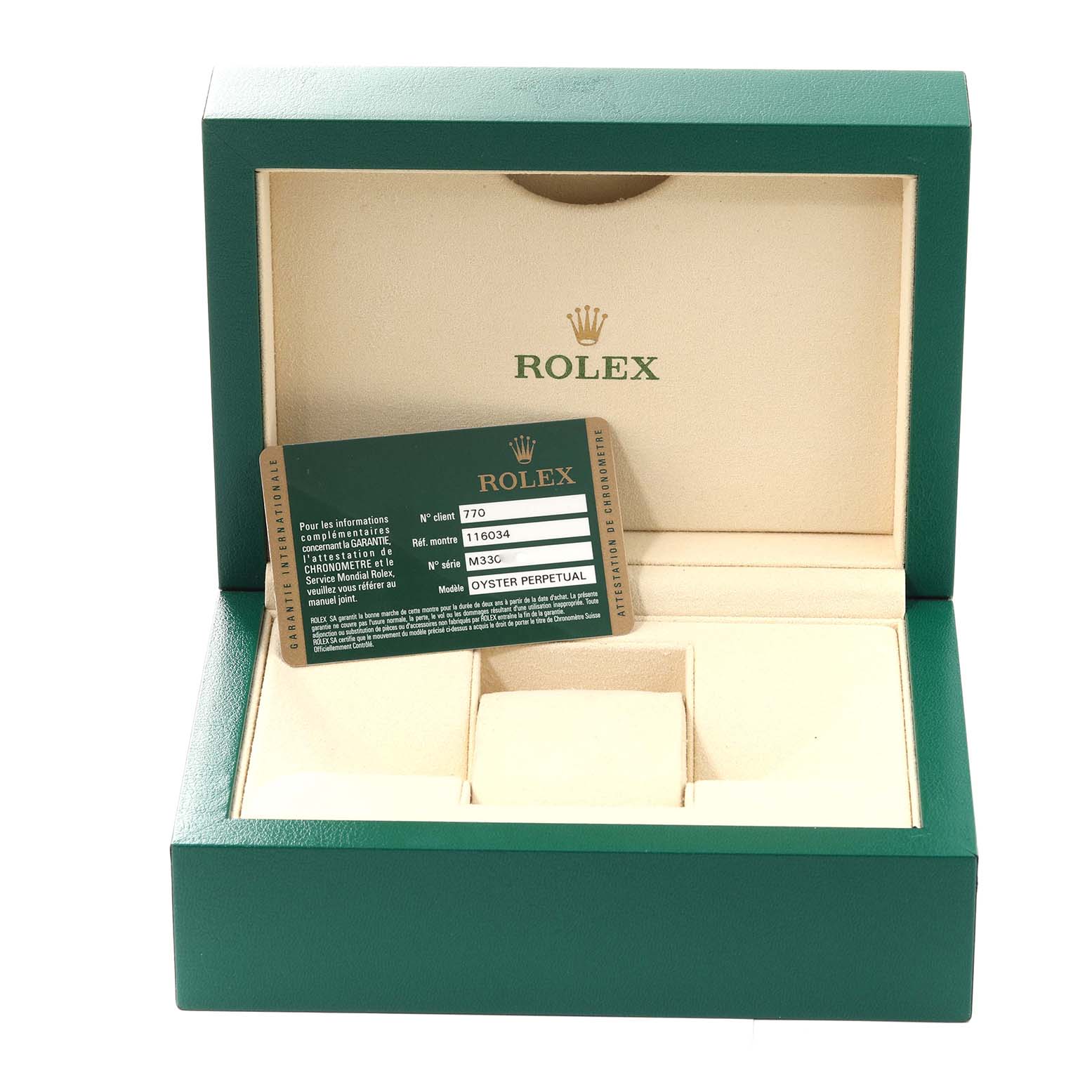 The image shows a green Rolex box for the Oyster Perpetual model, featuring the inner lining and a warranty card.