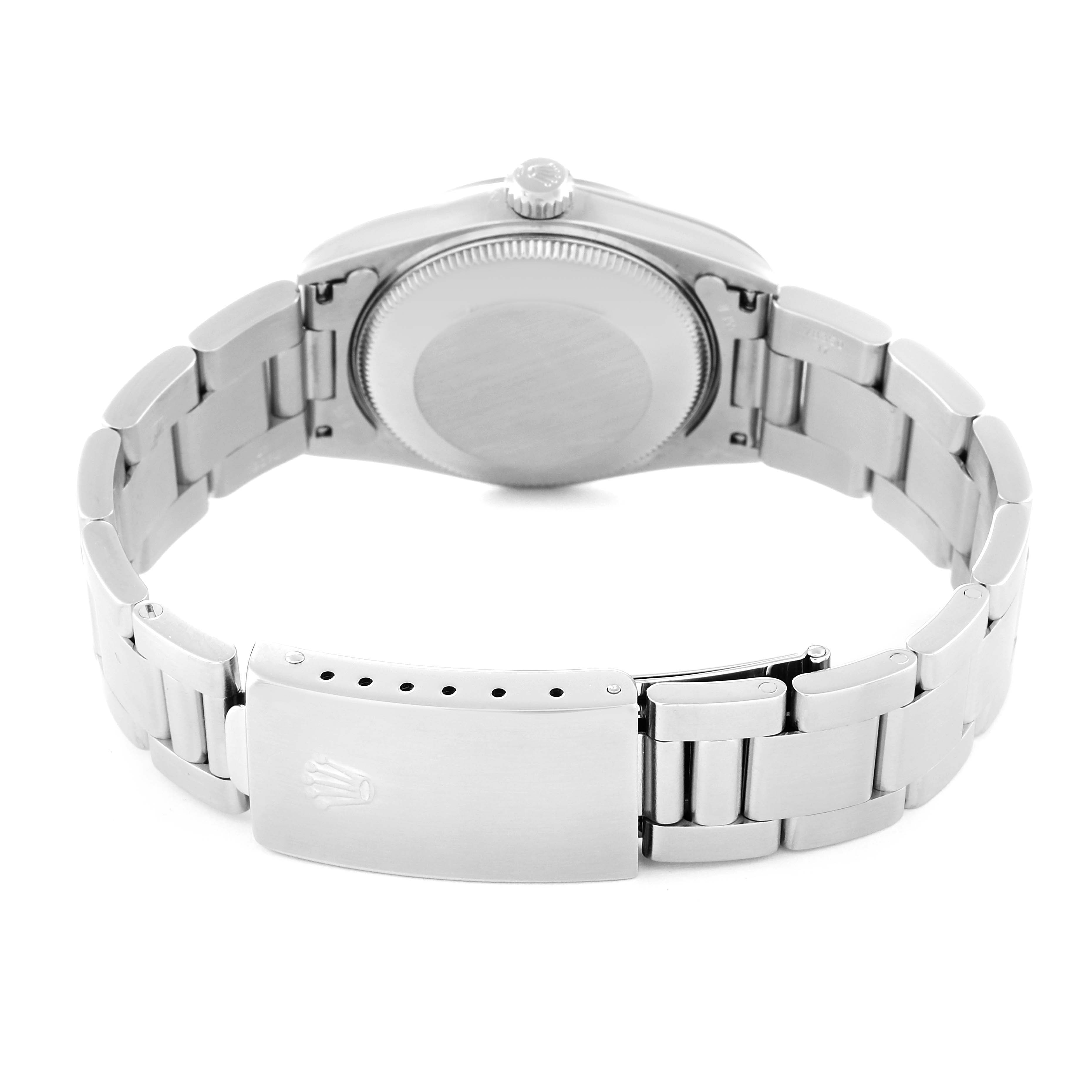 This image shows the rear view of a Mid-Size Rolex watch, highlighting the bracelet, clasp, and case back.