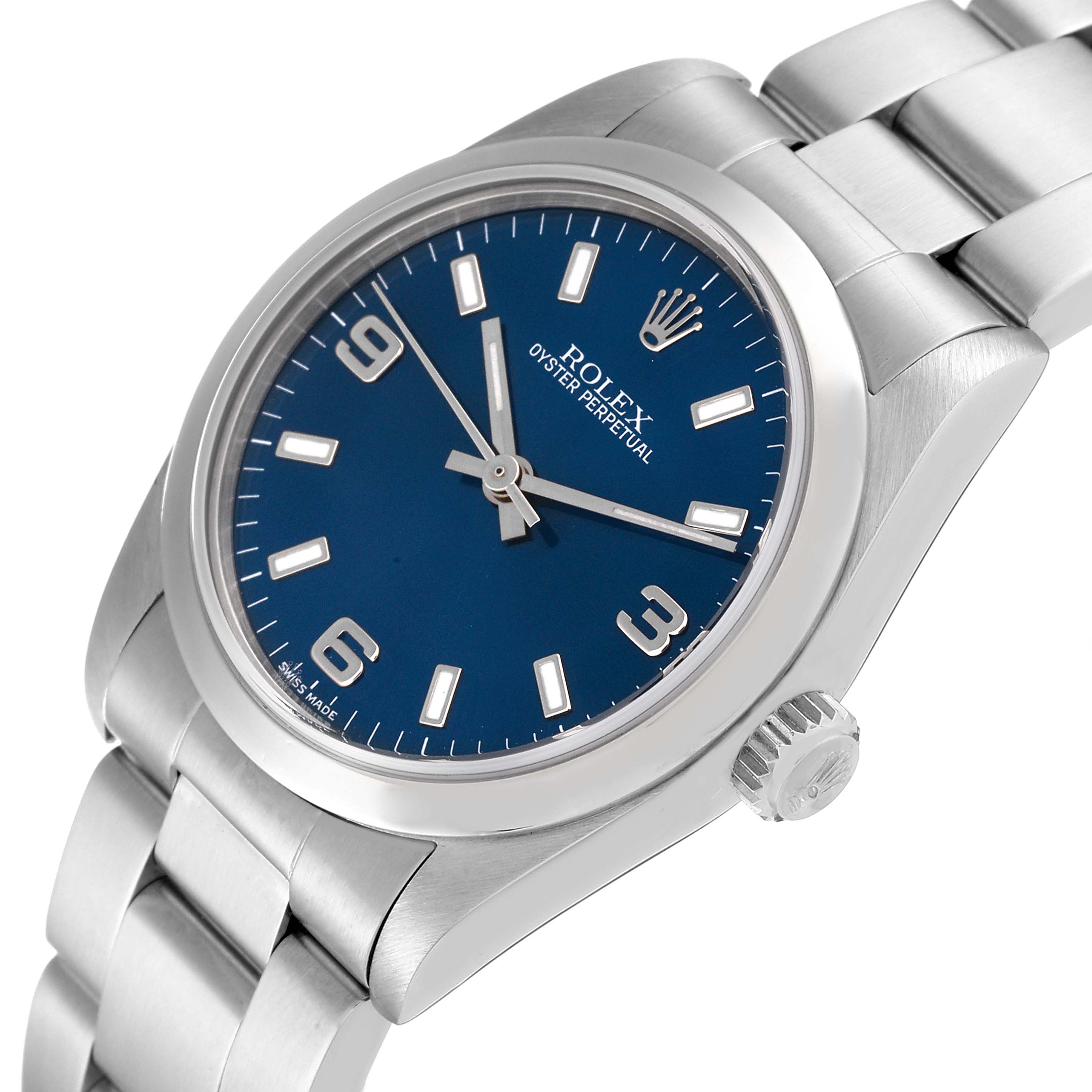 The image shows a detailed angled view of a Rolex Mid-Size 77080 Women's Stainless Steel Blue Dial 77080 Women's Stainless Steel Blue Dial Oyster Perpetual watch, focusing on the dial, bezel, and bracelet.