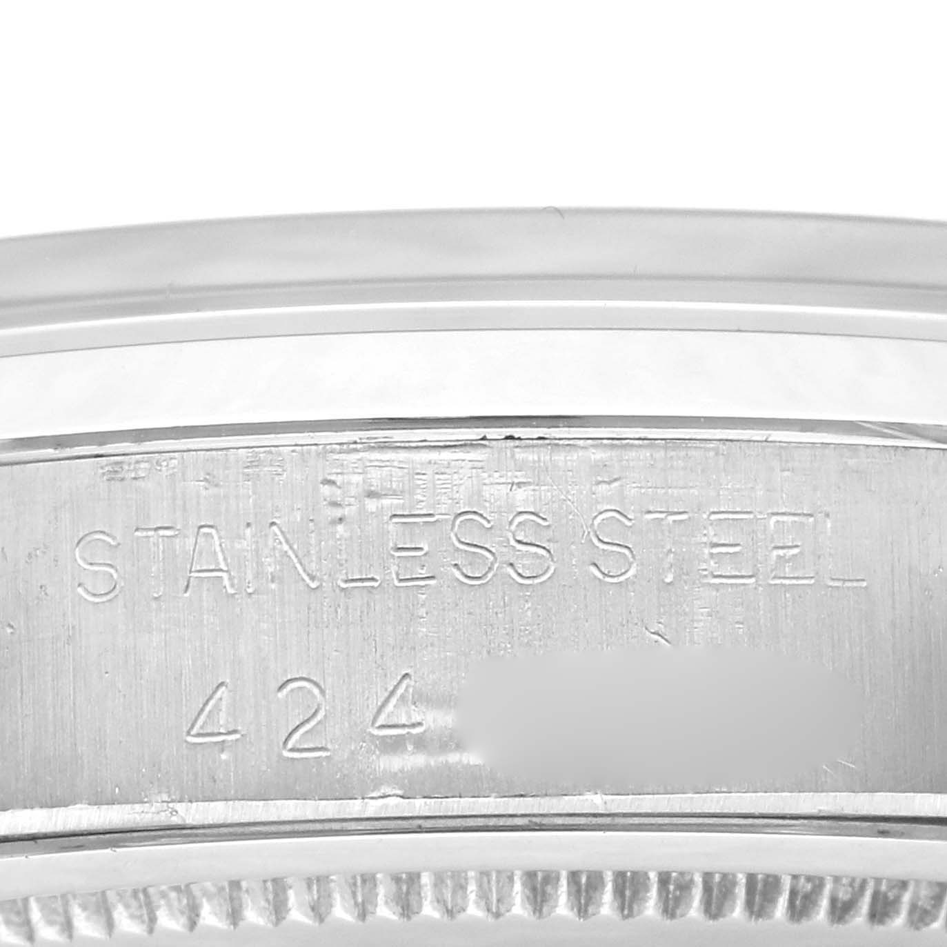 This image shows a close-up of the Rolex Vintage Collection 6694 Men's Stainless Steel Silver Dial 6694 Men's Stainless Steel Silver Dial watch case, highlighting the stainless steel material and some serial numbers.