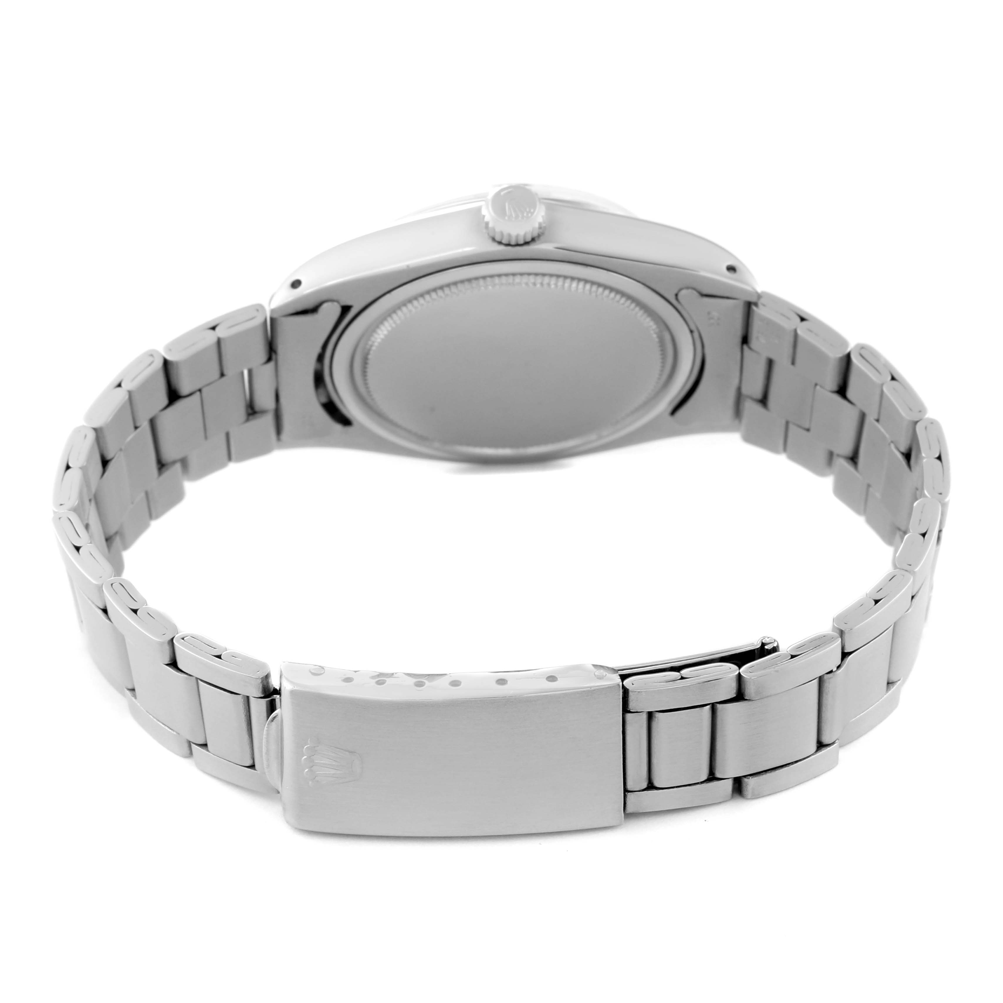 The image shows the back view of a Rolex Vintage Collection 6694 Men's Stainless Steel Silver Dial 6694 Men's Stainless Steel Silver Dial watch, focusing on the case back, crown, and stainless steel bracelet.