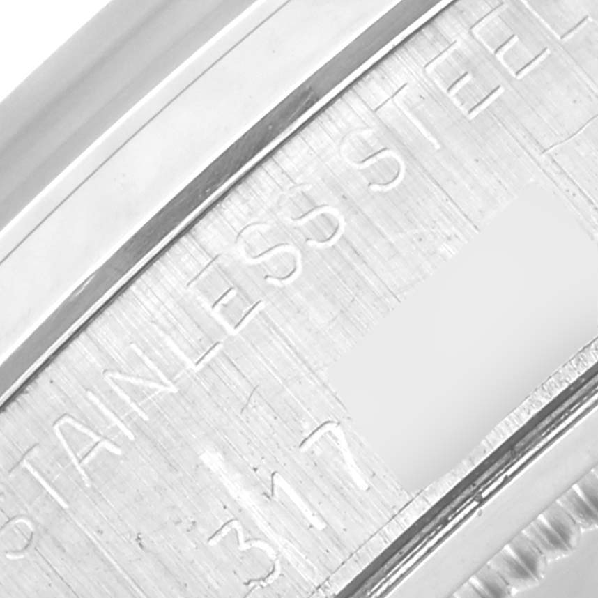 The image shows a close-up angle of the stainless steel case back of the Rolex Vintage Collection 6694 Men's Stainless Steel Silver Dial 6694 Men's Stainless Steel Silver Dial model.