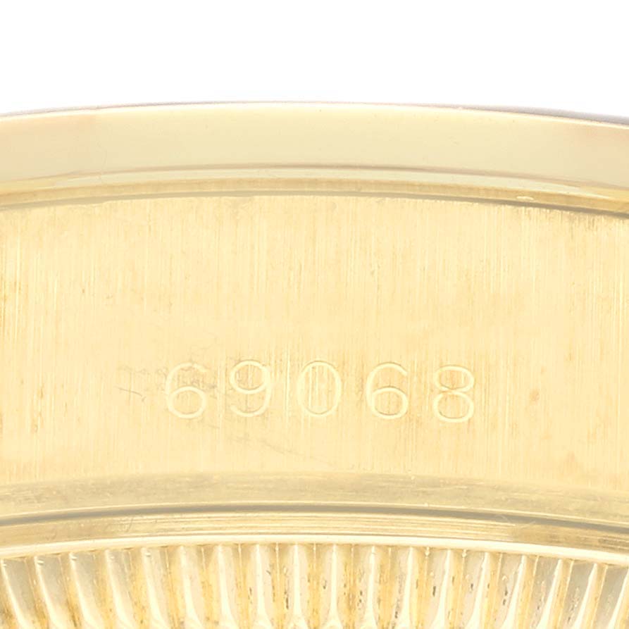 This image shows an engraving of the model number on the caseback of a Rolex President 69068 Women's Yellow Gold Champagne Dial 69068 Women's Yellow Gold Champagne Dial watch.