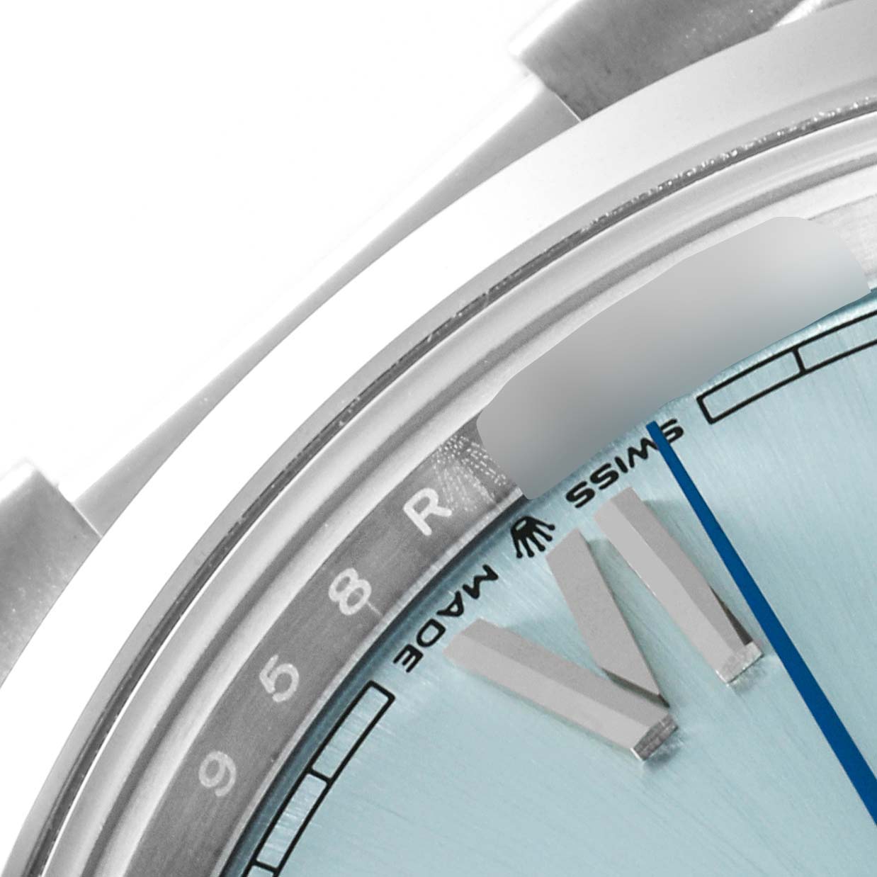 The image shows a close-up angle of the dial, bezel, and part of the bracelet of a Rolex President 228206 Men's Platinum Blue Dial 228206 Men's Platinum Blue Dial model watch.