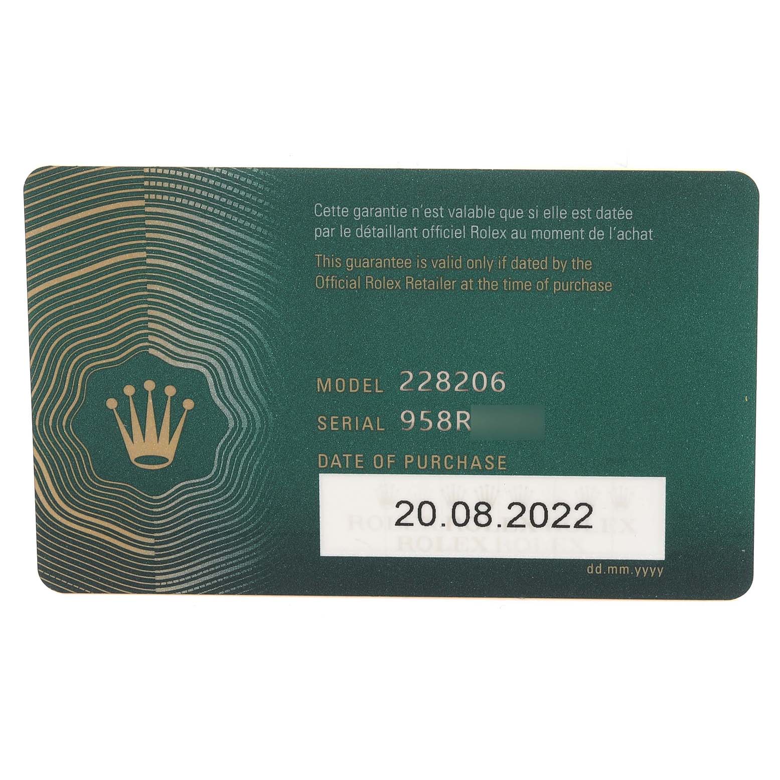 The image shows a guarantee card for a Rolex President 228206 Men's Platinum Blue Dial 228206 Men's Platinum Blue Dial model 228206, including the serial number and date of purchase.
