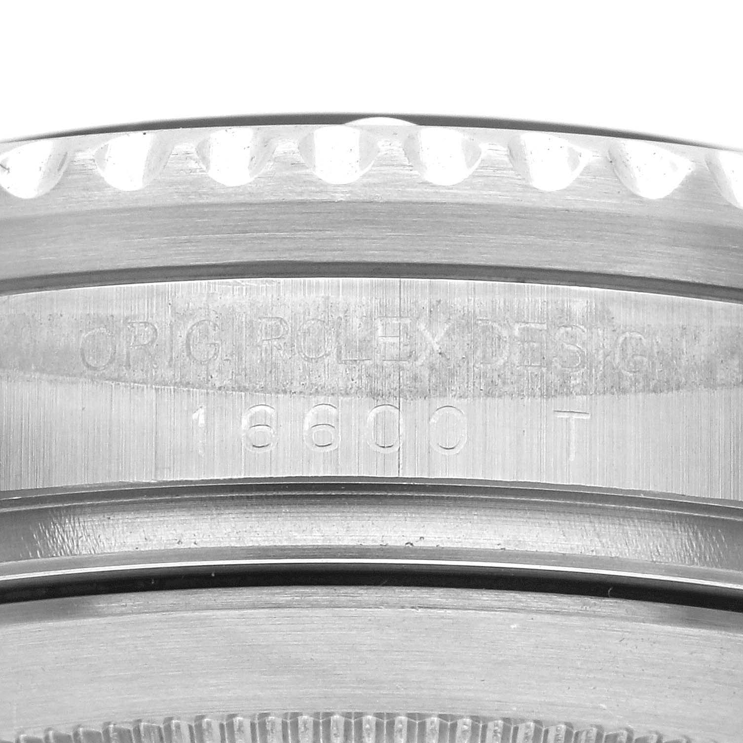 This image shows a close-up of the side casing of a Rolex Sea-Dweller 16600 Men
s Stainless Steel Black Dial 16600 Men
s Stainless Steel Black Dial watch, displaying engravings including the model number 16600.