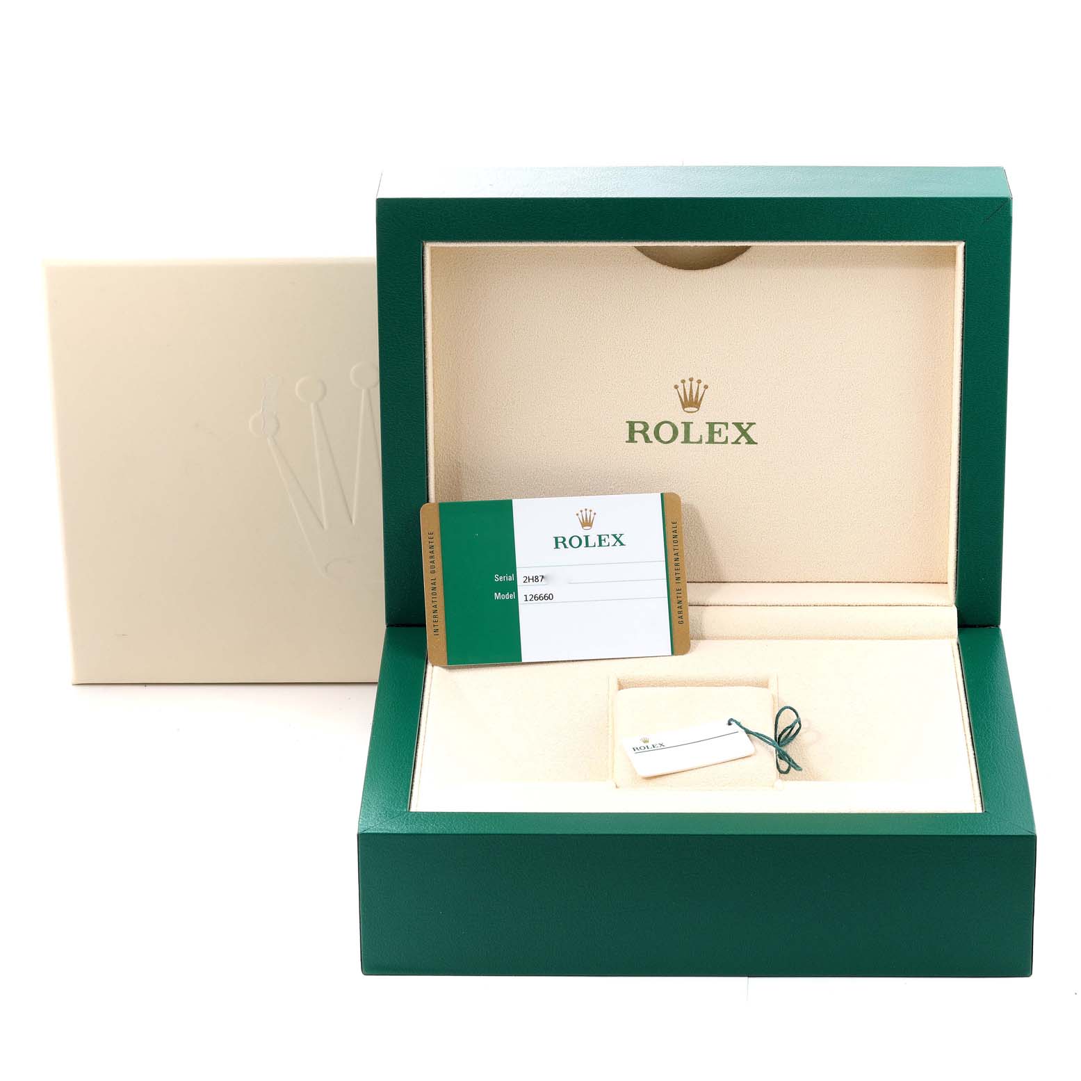 This image shows an open Rolex Sea-Dweller 126660 Men's Stainless Steel Blue Dial 126660 Men's Stainless Steel Blue Dial box, displaying the interior along with the warranty card and tag.