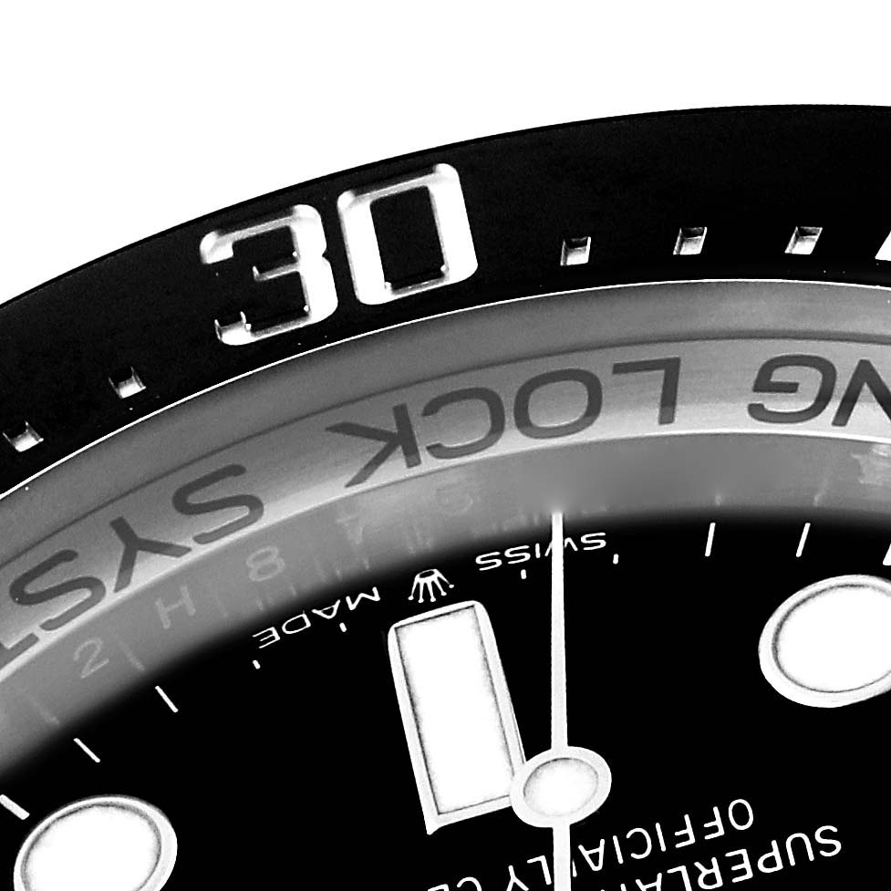 The image shows a close-up view of the bezel and part of the dial of a Rolex Sea-Dweller 126660 Men's Stainless Steel Blue Dial 126660 Men's Stainless Steel Blue Dial watch.