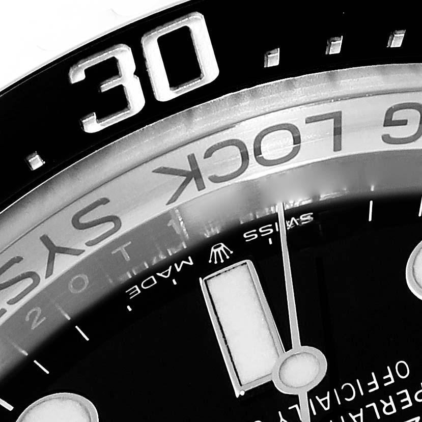 This image shows a close-up angle of the bezel and dial of the Rolex Sea-Dweller 126660 Men's Stainless Steel Black Dial 126660 Men's Stainless Steel Black Dial watch.
