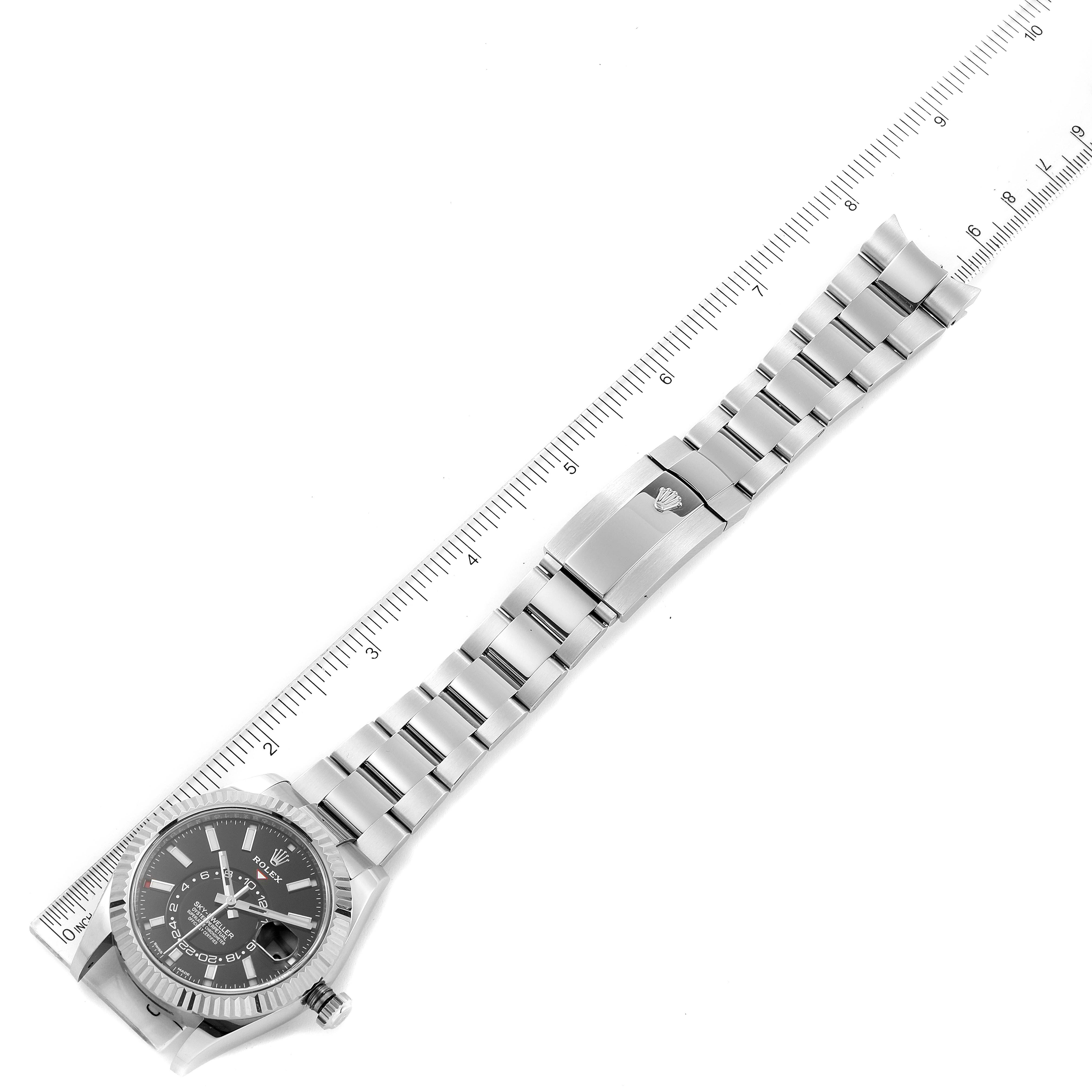 The image shows a full view of the Rolex Sky-Dweller 326934 Men's Stainless Steel Black Dial 326934 Men's Stainless Steel Black Dial watch from an overhead angle, including the dial, bezel, and bracelet.