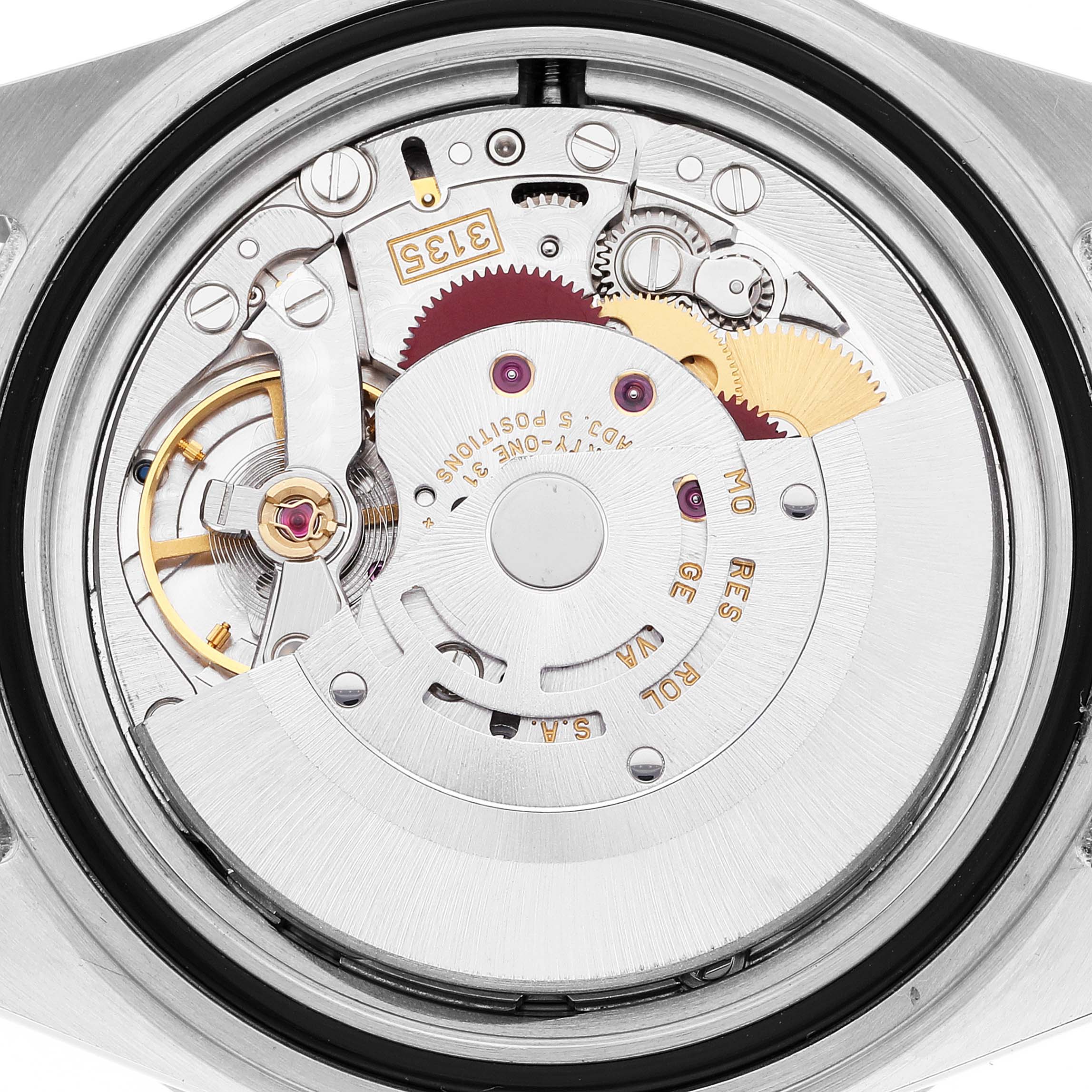 The image shows the internal mechanism of a Rolex Submariner 16613 Men's Steel and Gold (two tone) Blue Dial 16613 Men's Steel and Gold (two tone) Blue Dial watch viewed from the back, highlighting its movement components.