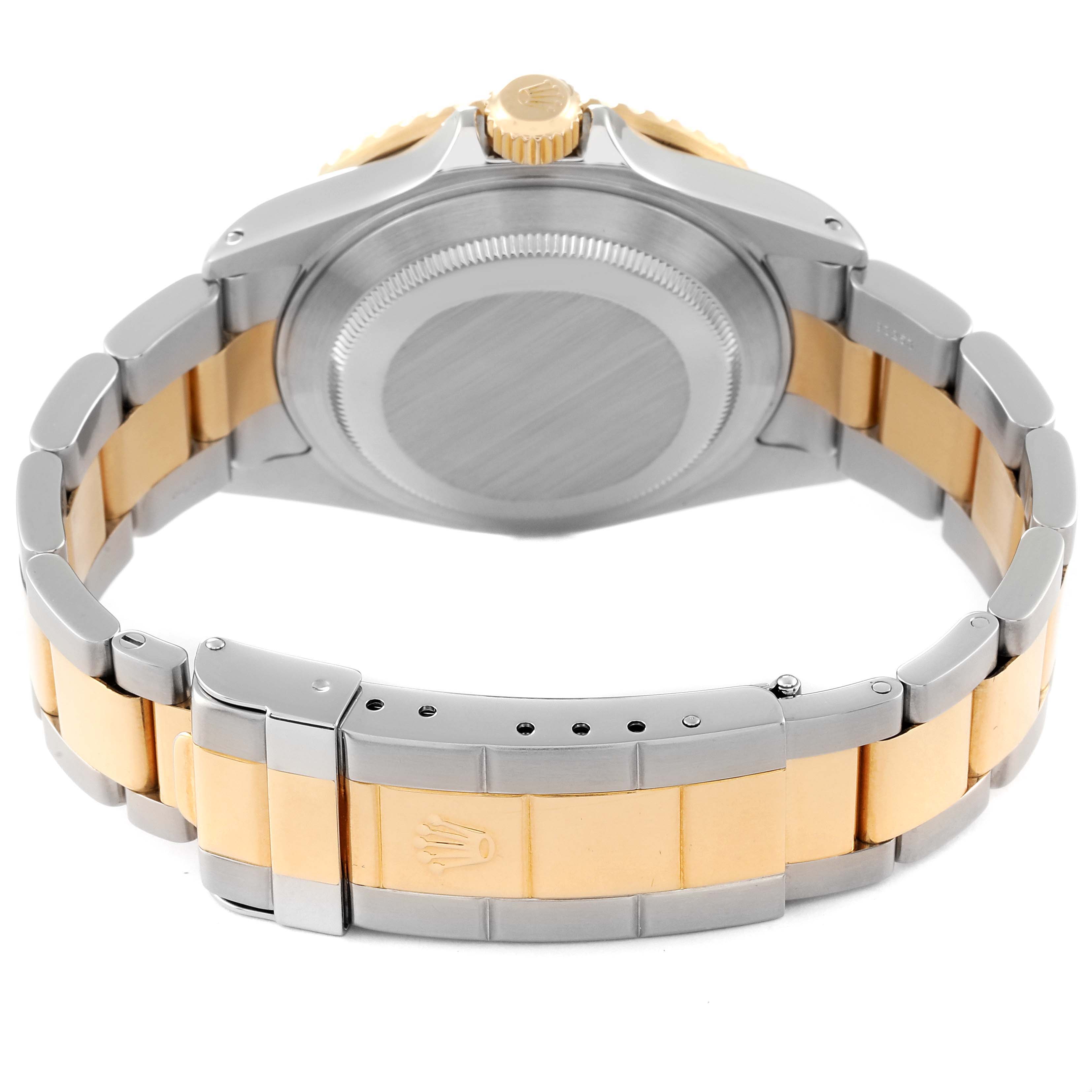 The image shows the back of a Rolex Submariner 16613 Men's Steel and Gold (two tone) Blue Dial 16613 Men's Steel and Gold (two tone) Blue Dial watch, highlighting the case back and bracelet links.