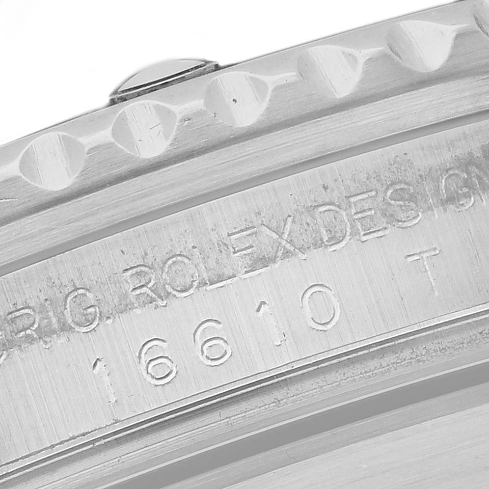 This close-up image shows the engraved caseback and part of the bezel of a Rolex Submariner 16610 Men
s Stainless Steel Black Dial 16610 Men
s Stainless Steel Black Dial 16610 model.