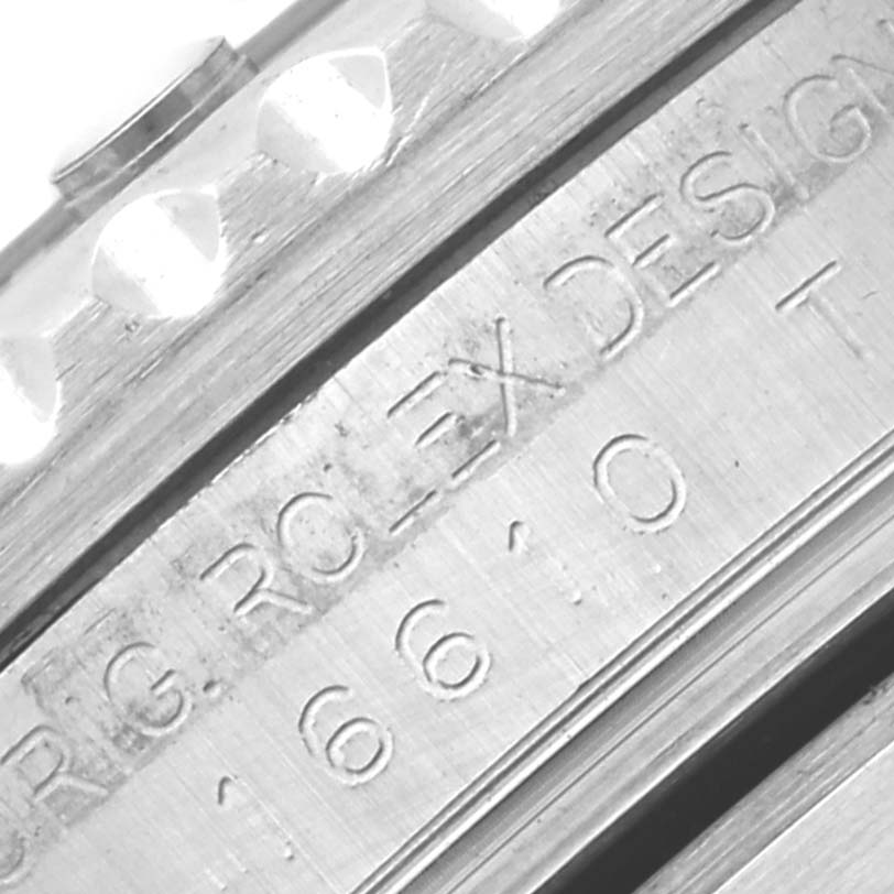 This close-up image shows the engraved side of the case of a Rolex Submariner 16610 Men
s Stainless Steel Black Dial 16610 Men
s Stainless Steel Black Dial watch.