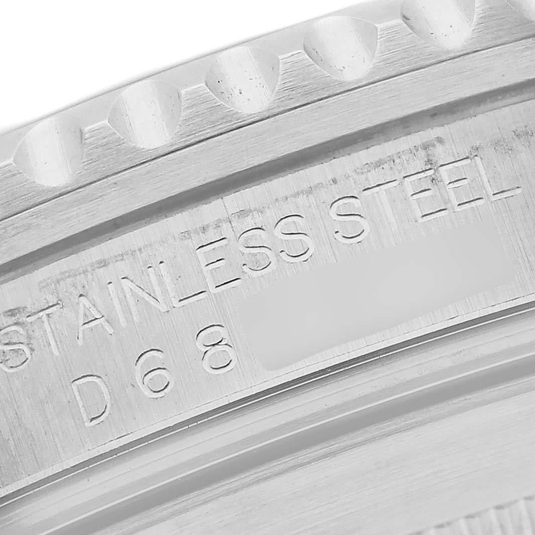 The image shows a close-up of the casing with an engraved inscription on a Rolex Submariner 16610 Men
s Stainless Steel Black Dial 16610 Men
s Stainless Steel Black Dial watch.